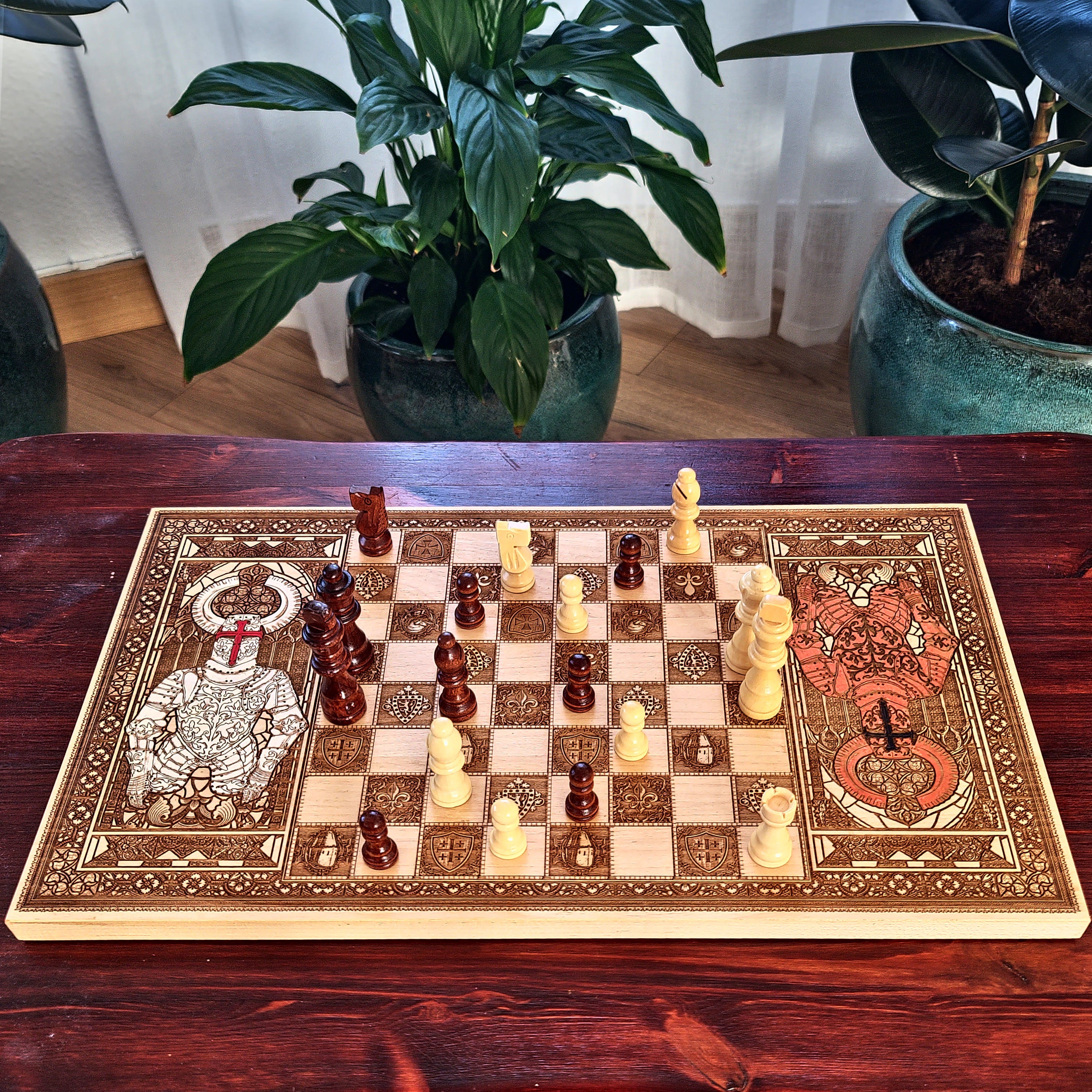 An ornate rectangular chessboard with decorative engraved or painted borders and matching chess pieces