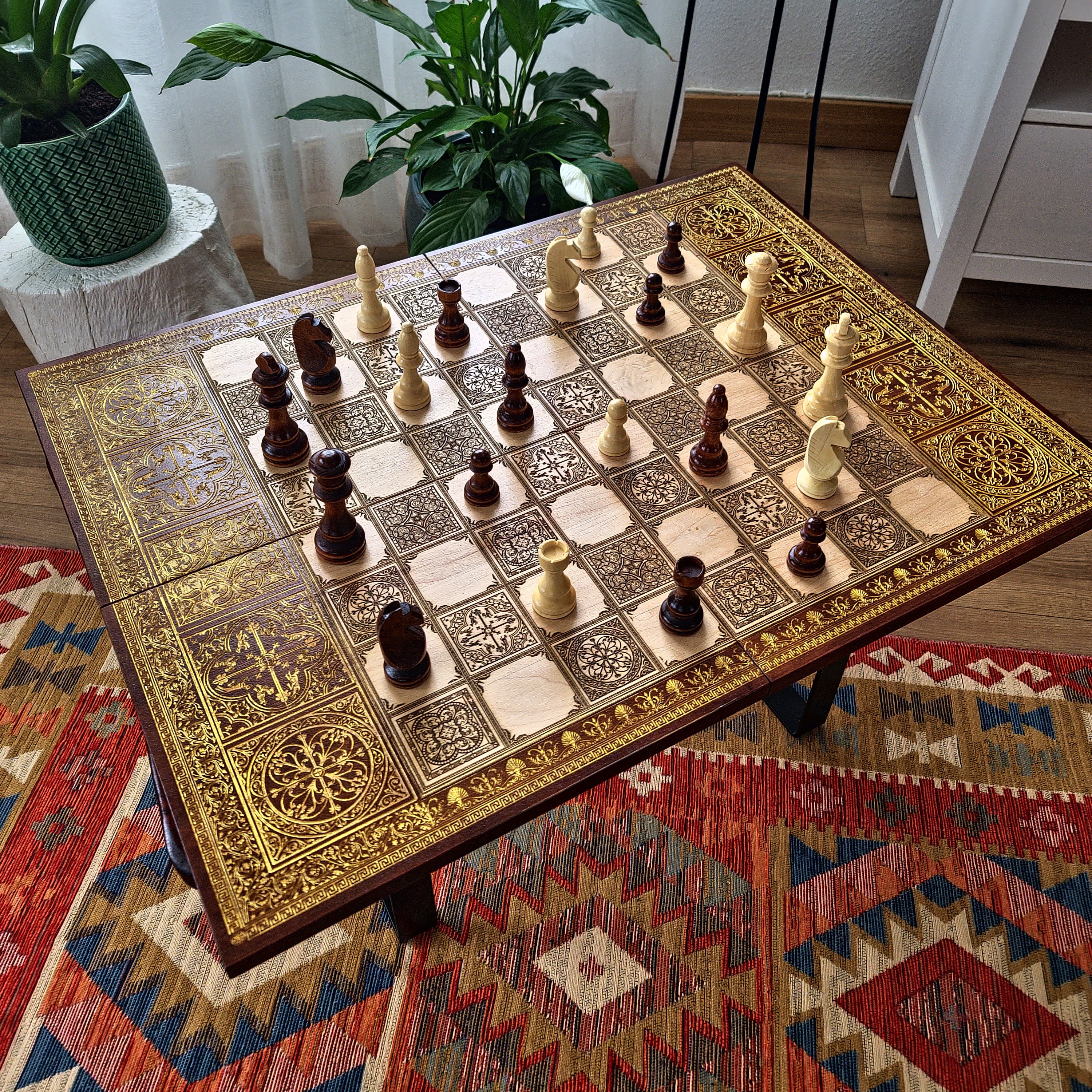 Close-up of detailed laser engraving on medieval themed wooden chessboard showing intricate artwork