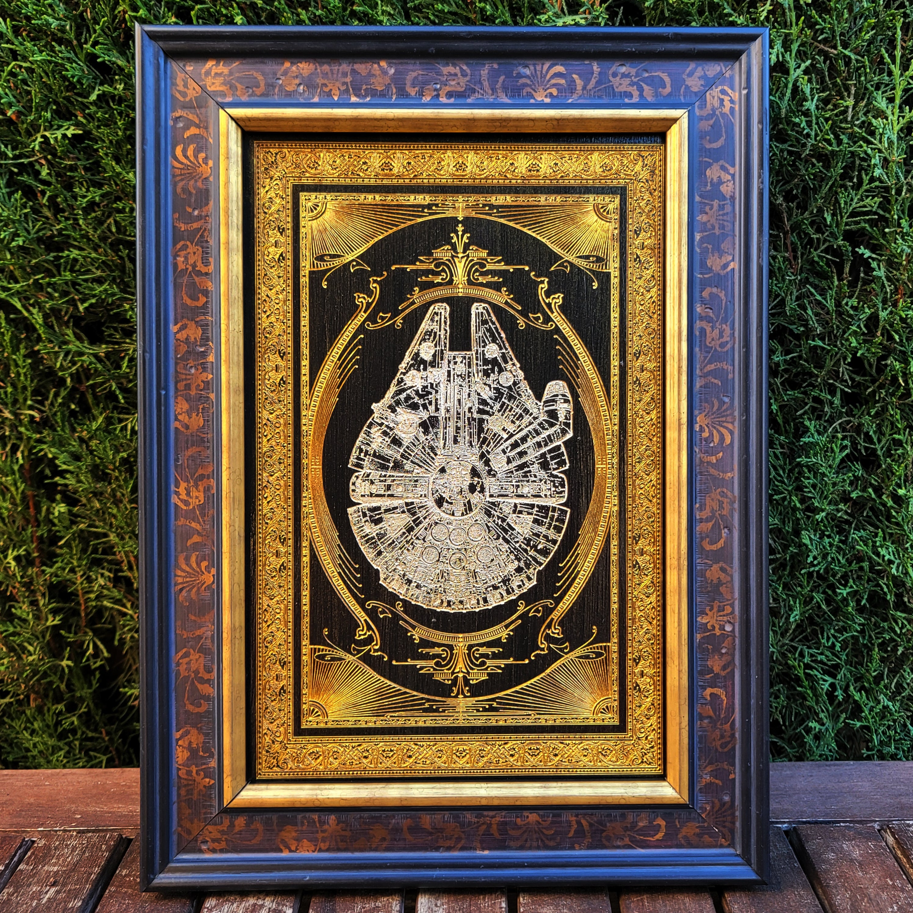 Millennium Falcon wall decor, engraved in dark wood with sci-fi detail.