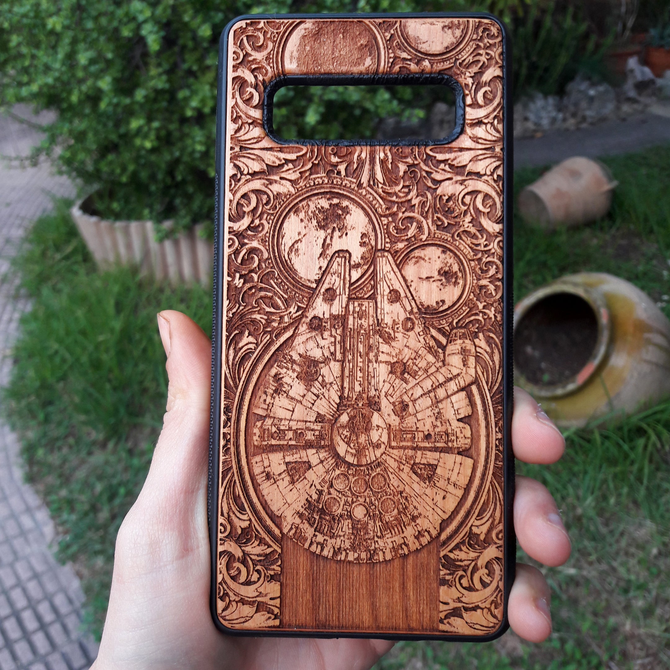 Hand-painted wood phone case featuring Millennium Falcon, Star Wars design