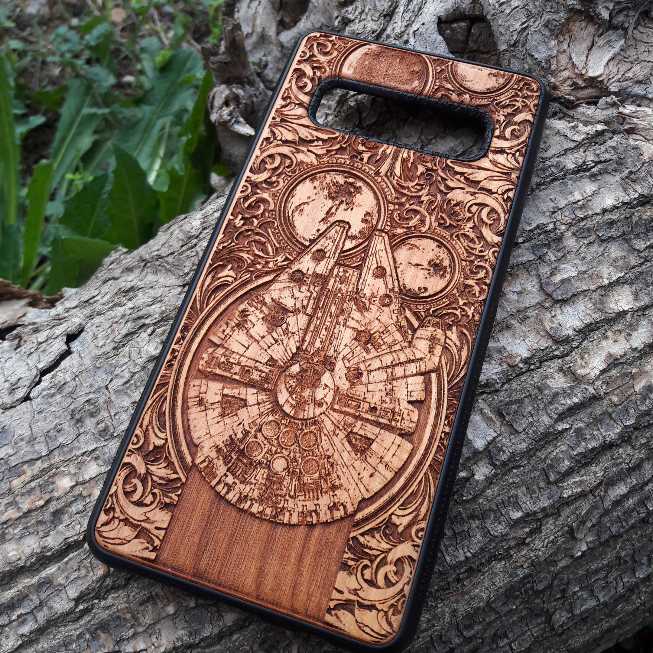 Star Wars wood phone case with Millennium Falcon design, laser-engraved for iPhone  and Samsung Galaxy S, slim and durable.