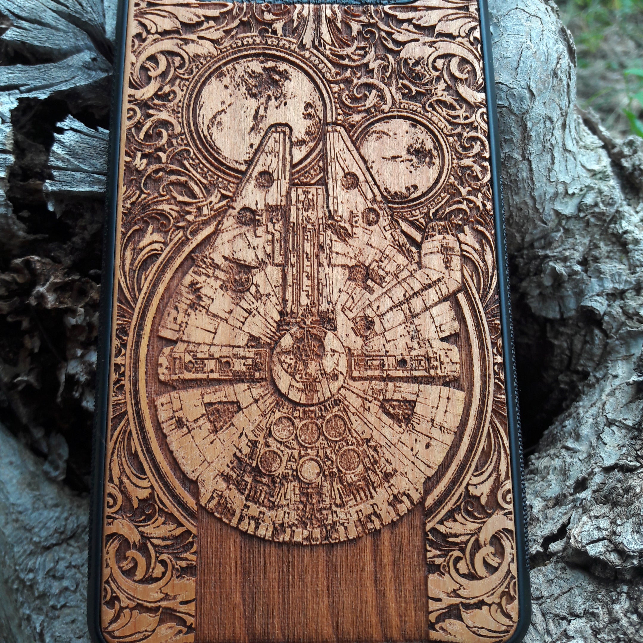 Star Wars wood phone case with Millennium Falcon design, laser-engraved for iPhone  and Samsung Galaxy S, slim and durable.