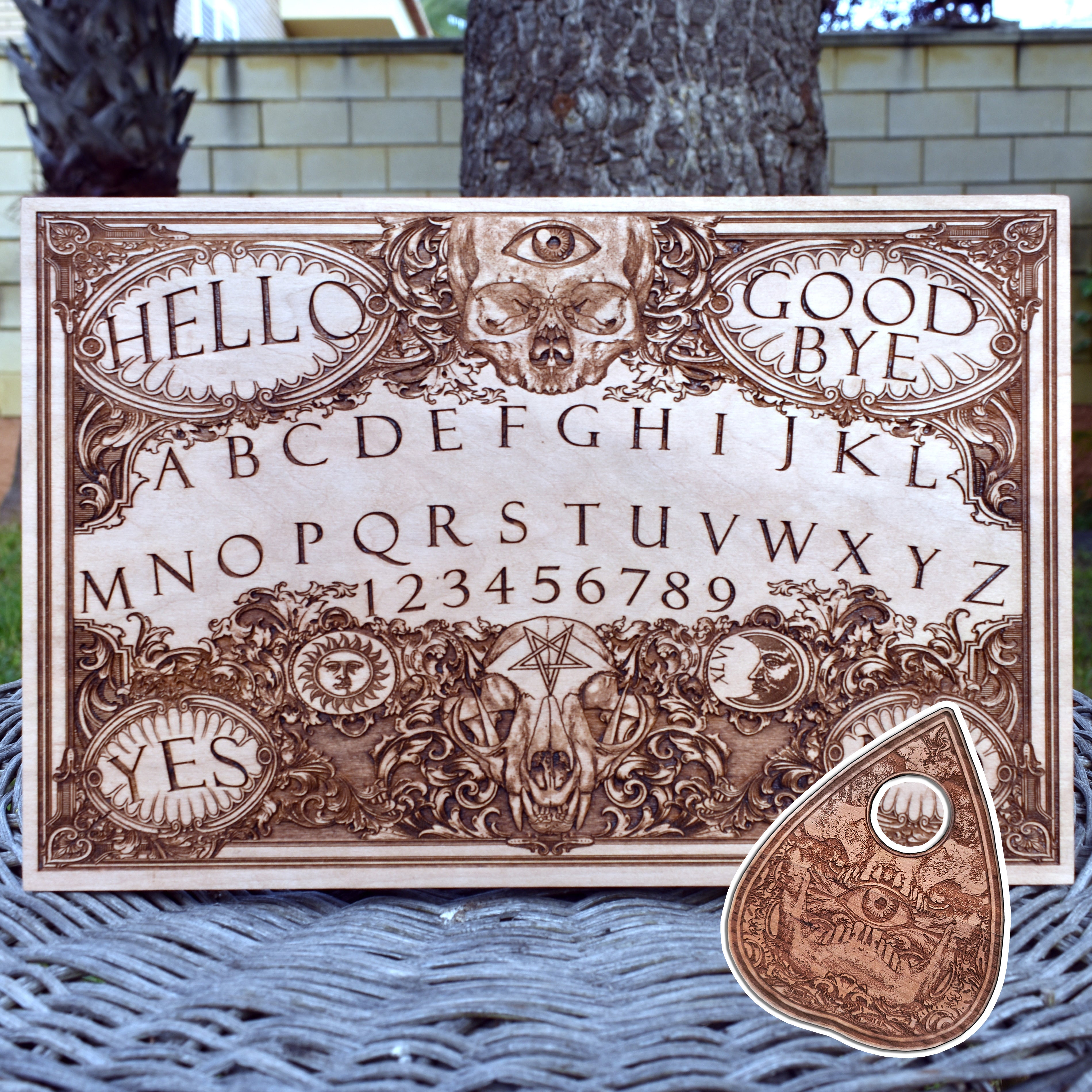 Hand-painted wooden Ouija board with gothic occult artwork.