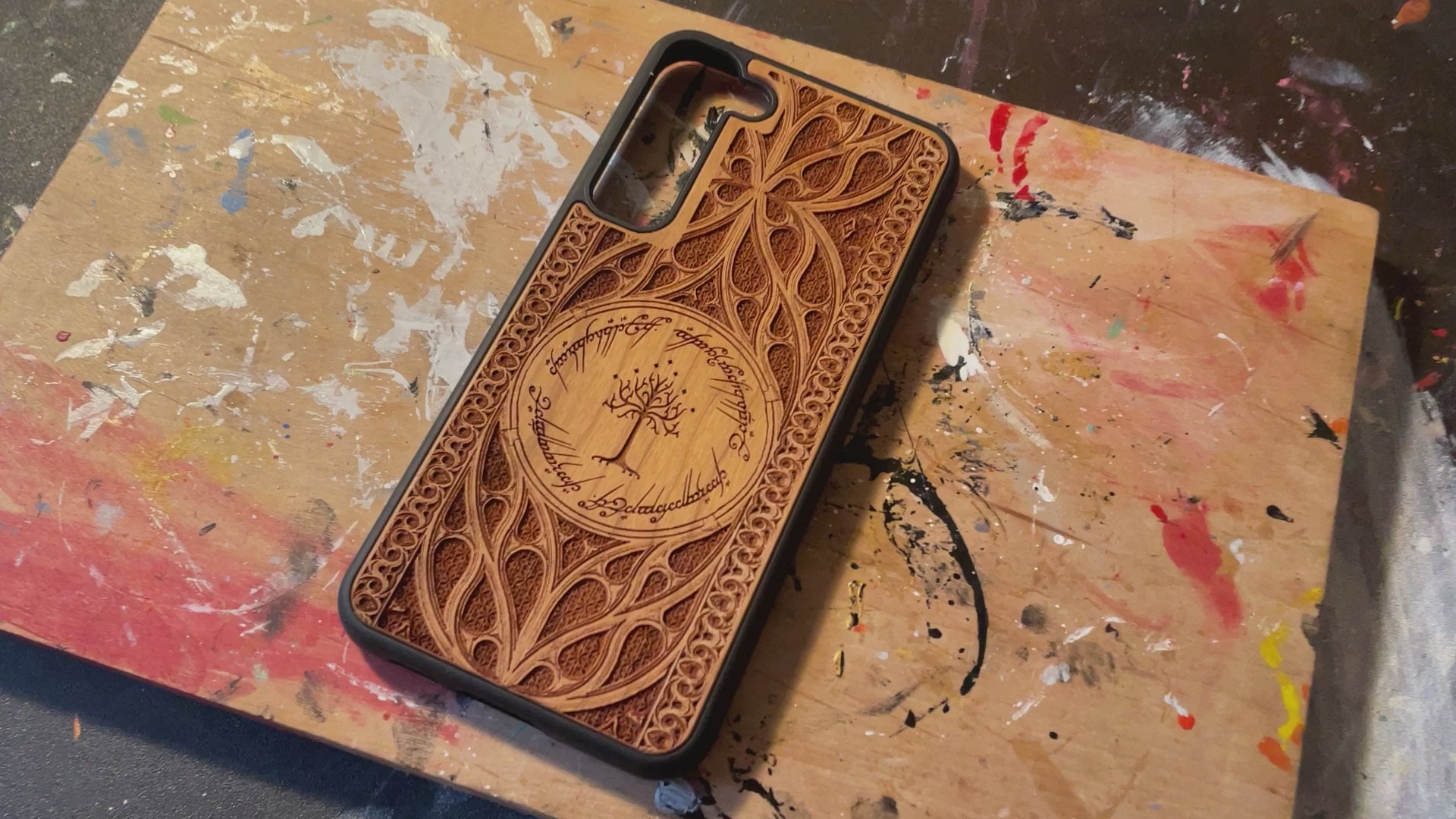 Load video: Handcrafted wooden phone case with intricate laser-engraved design, showcased in a 360-degree close-up. Premium natural wood, eco-friendly, and durable, perfect for iPhone & Samsung users. Ideal for 5-year anniversary gifts, collectors, and nature lovers. Available in multiple engraved designs.