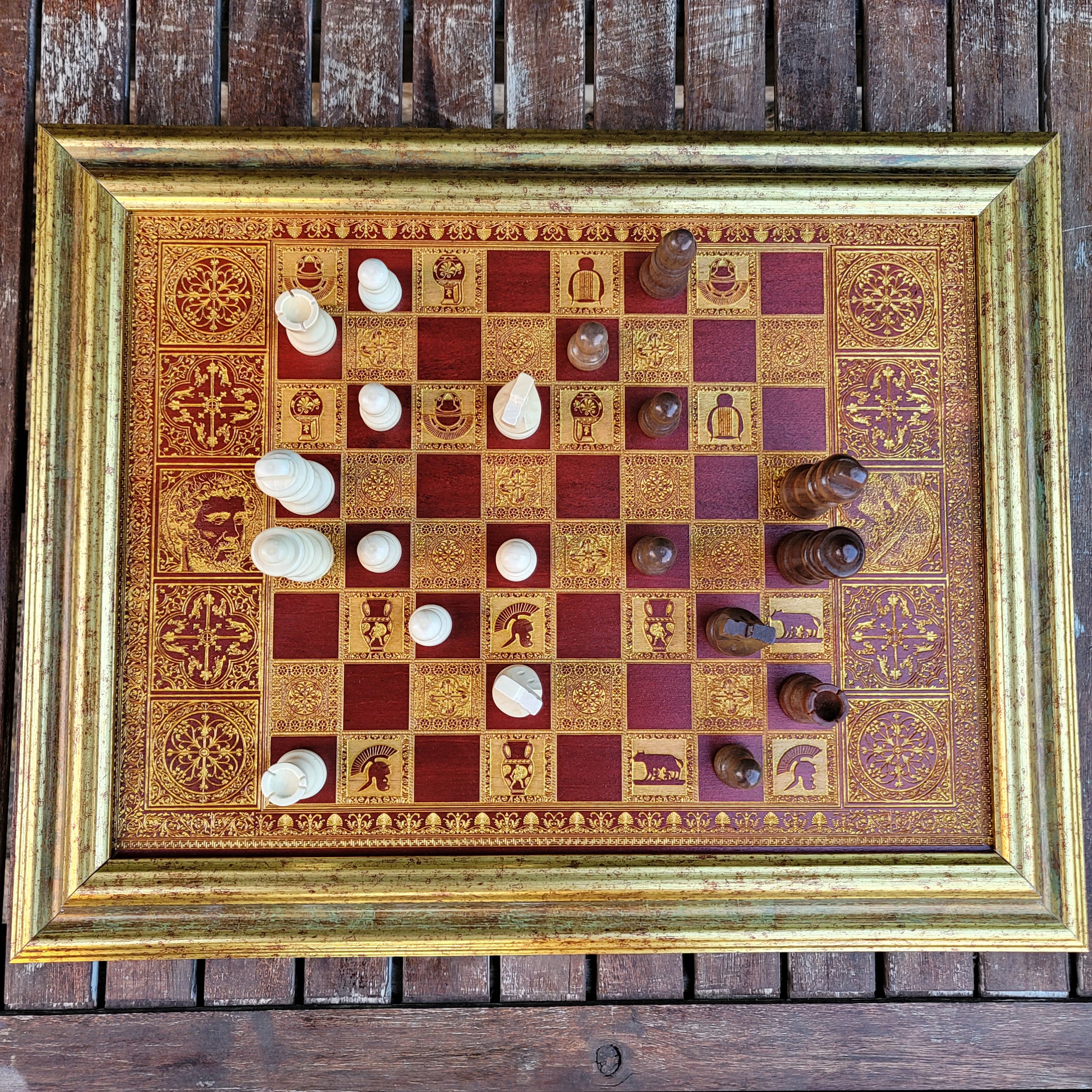 Handcrafted Roman Empire chessboard, laser-engraved with Caesar & Marcus Aurelius in an ornate wood-stained finish.