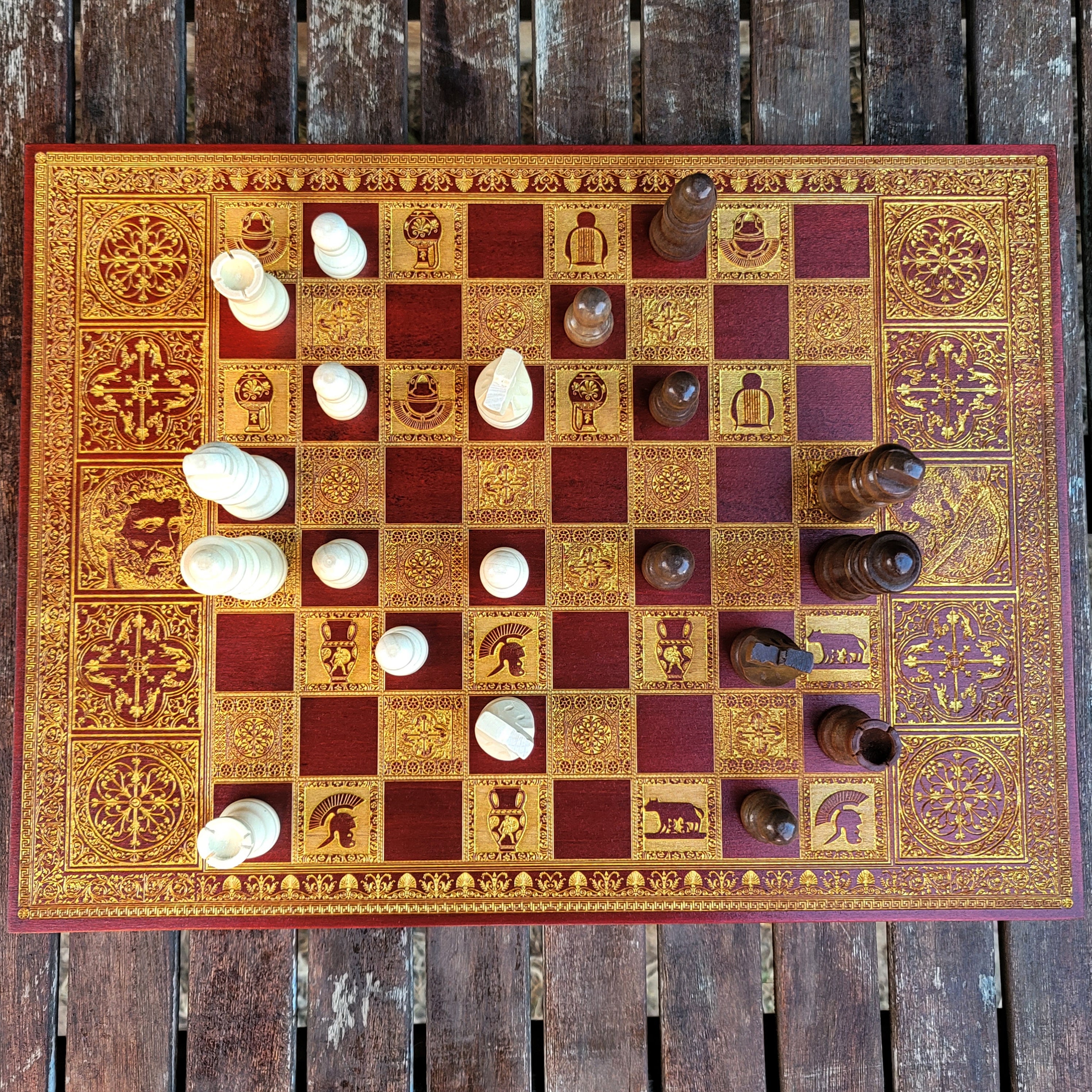 Handcrafted Roman Empire chessboard, laser-engraved with Caesar & Marcus Aurelius in an ornate wood-stained finish.