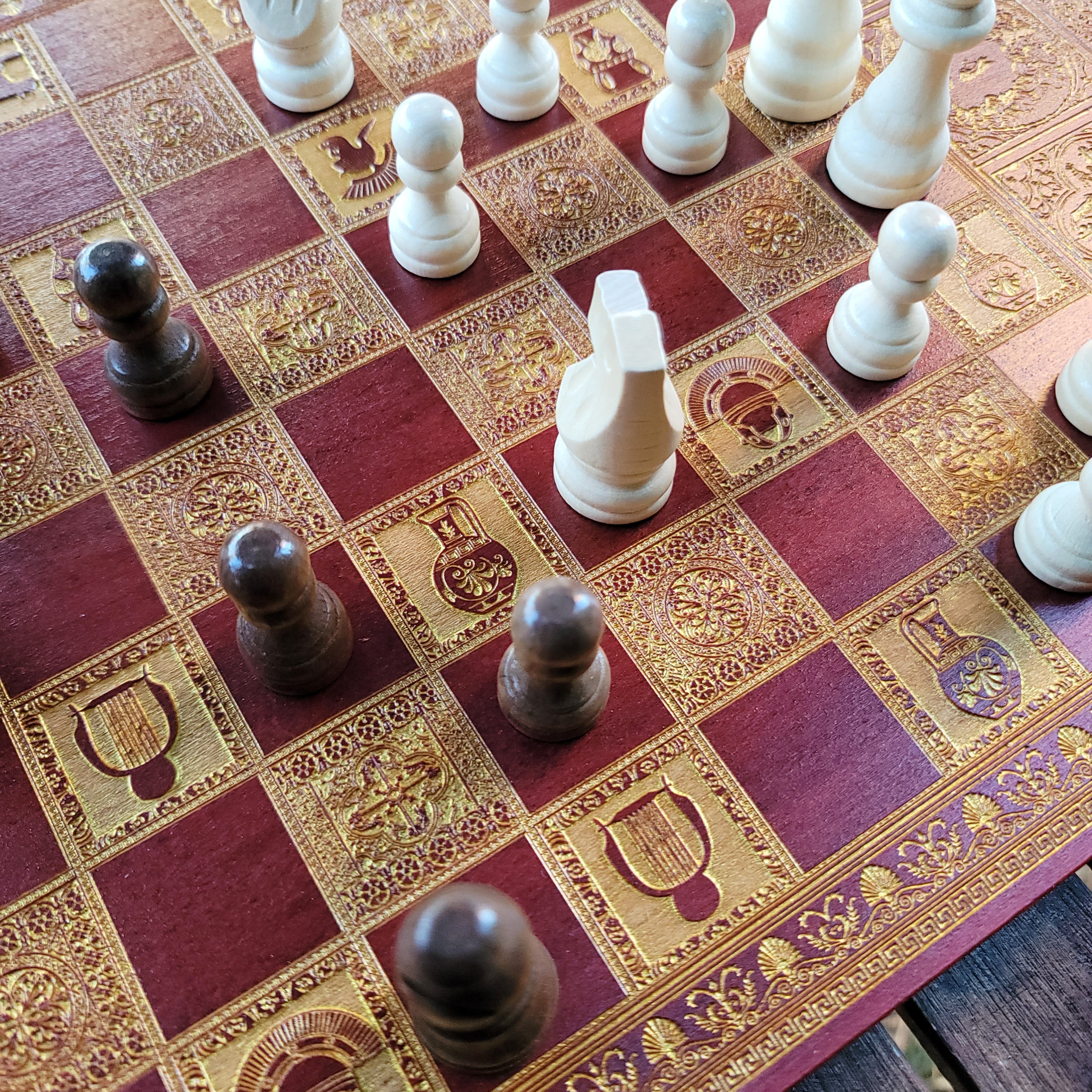 Close-up of Caesar and Marcus Aurelius laser-engraved on a handcrafted wooden chess set, ideal for collectors and history lovers.