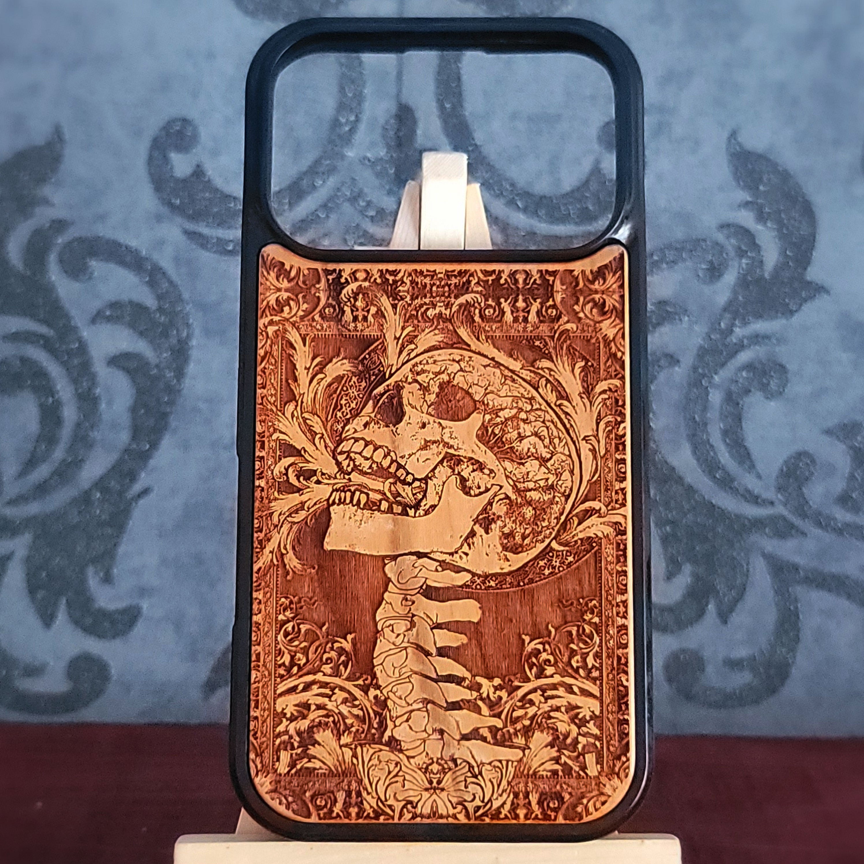 Engraved gothic skull wood phone case for iPhoneand Galaxy – dark art skeleton design.