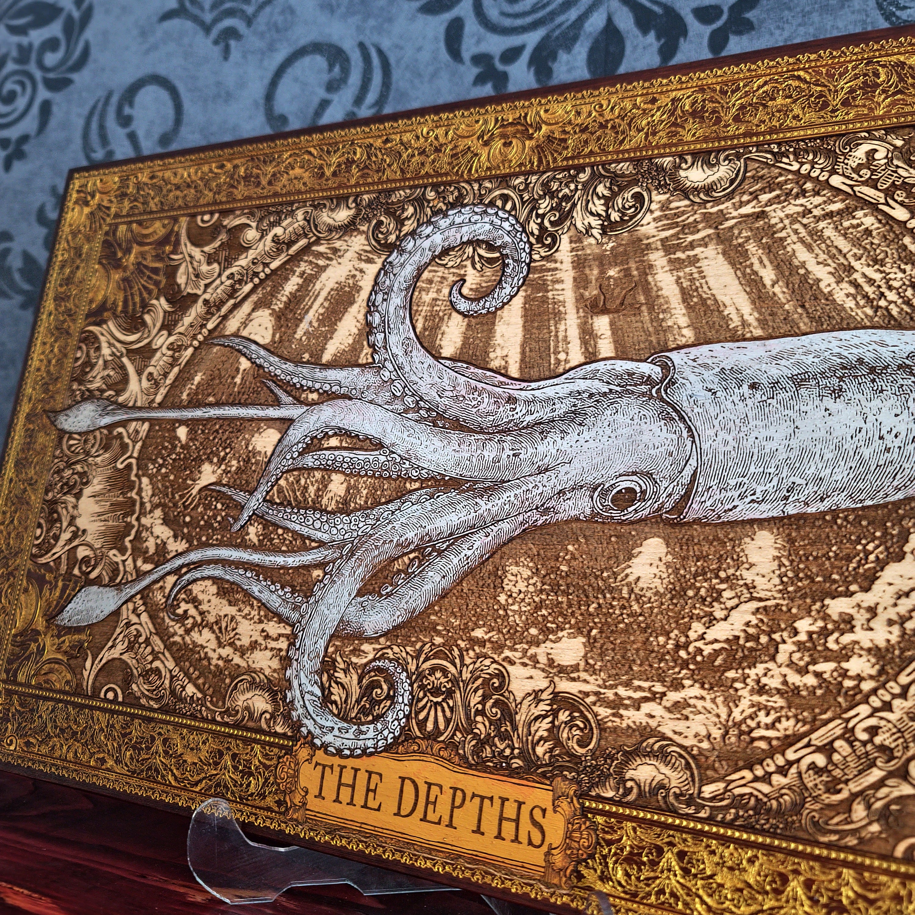 Hand painted and laser engraved wooden squid wall art in a nautical ocean style, featuring detailed marine-inspired design perfect for coastal and underwater themed home decor.