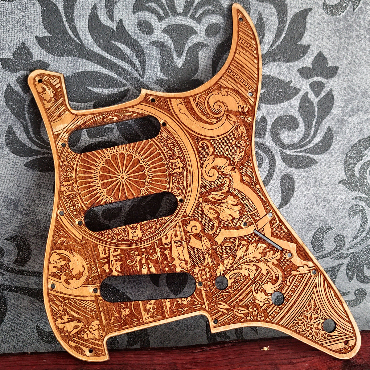 Personalized Stratocaster pickguard with custom artwork laser engraved on wood