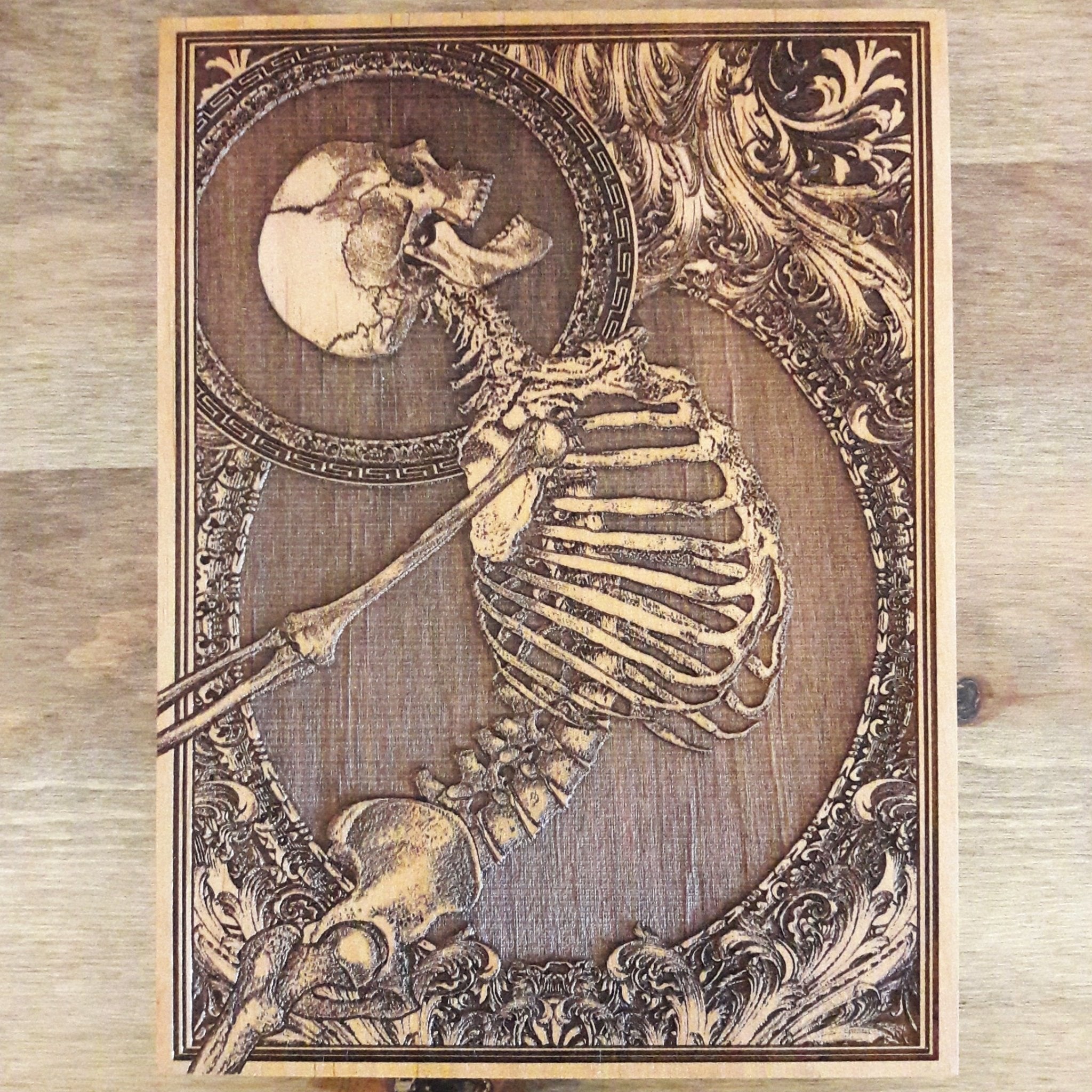 Hand-engraved skeleton artwork on wood, gothic-inspired mini wall art, perfect for horror lovers and alternative decor.