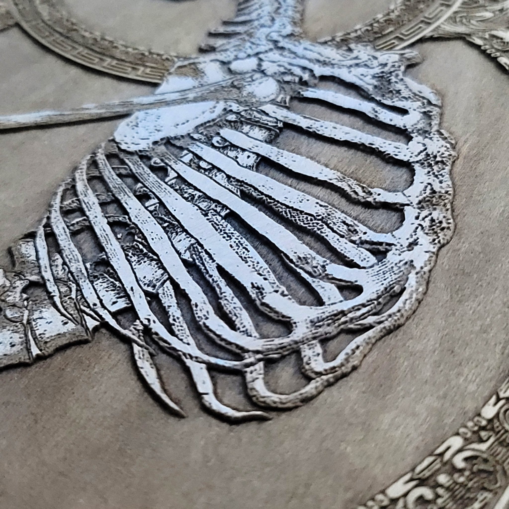 Spooky hand-painted wooden artwork, gothic skeleton-themed decor.