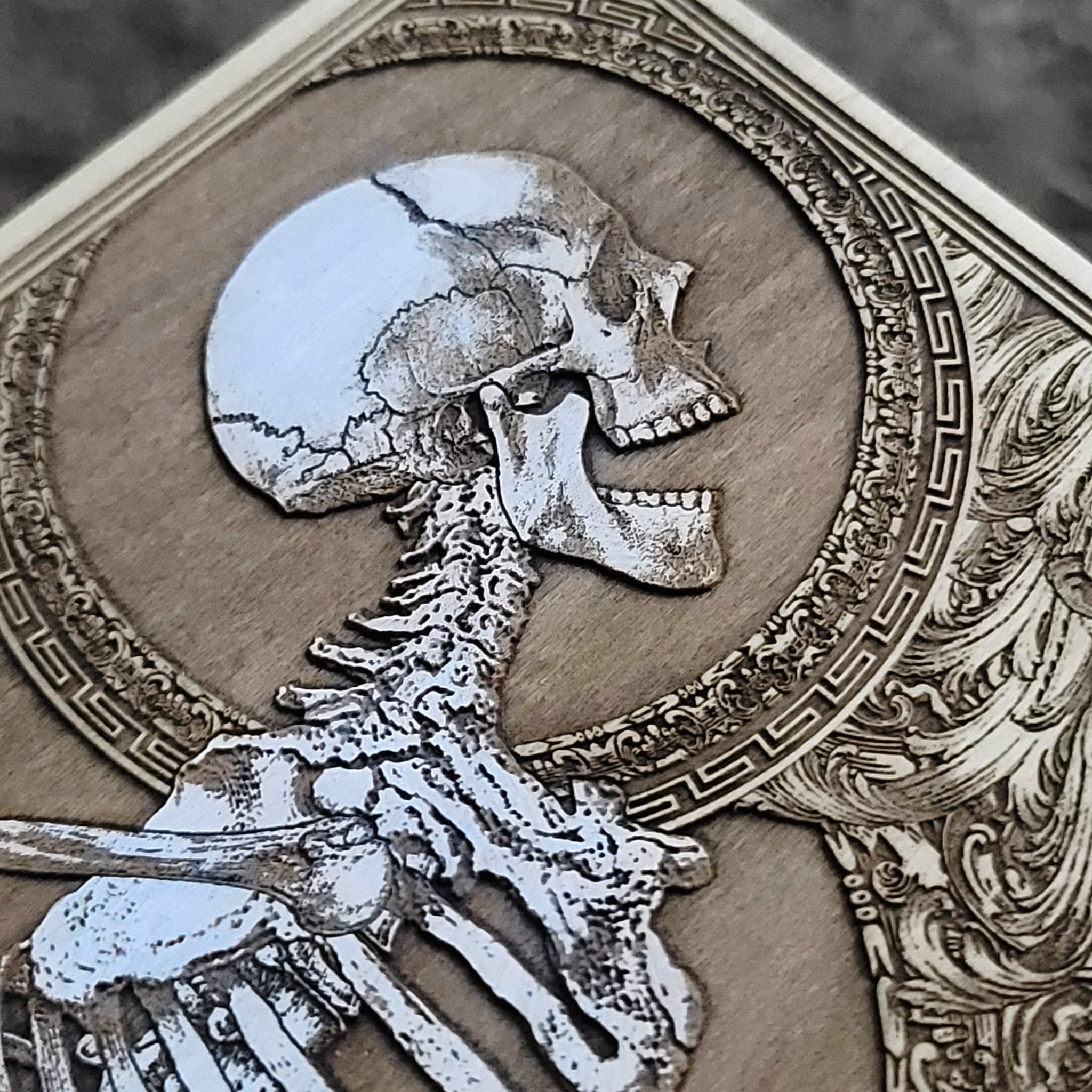 Eerie gothic skeleton wall hanging, handcrafted skull artwork on wood.