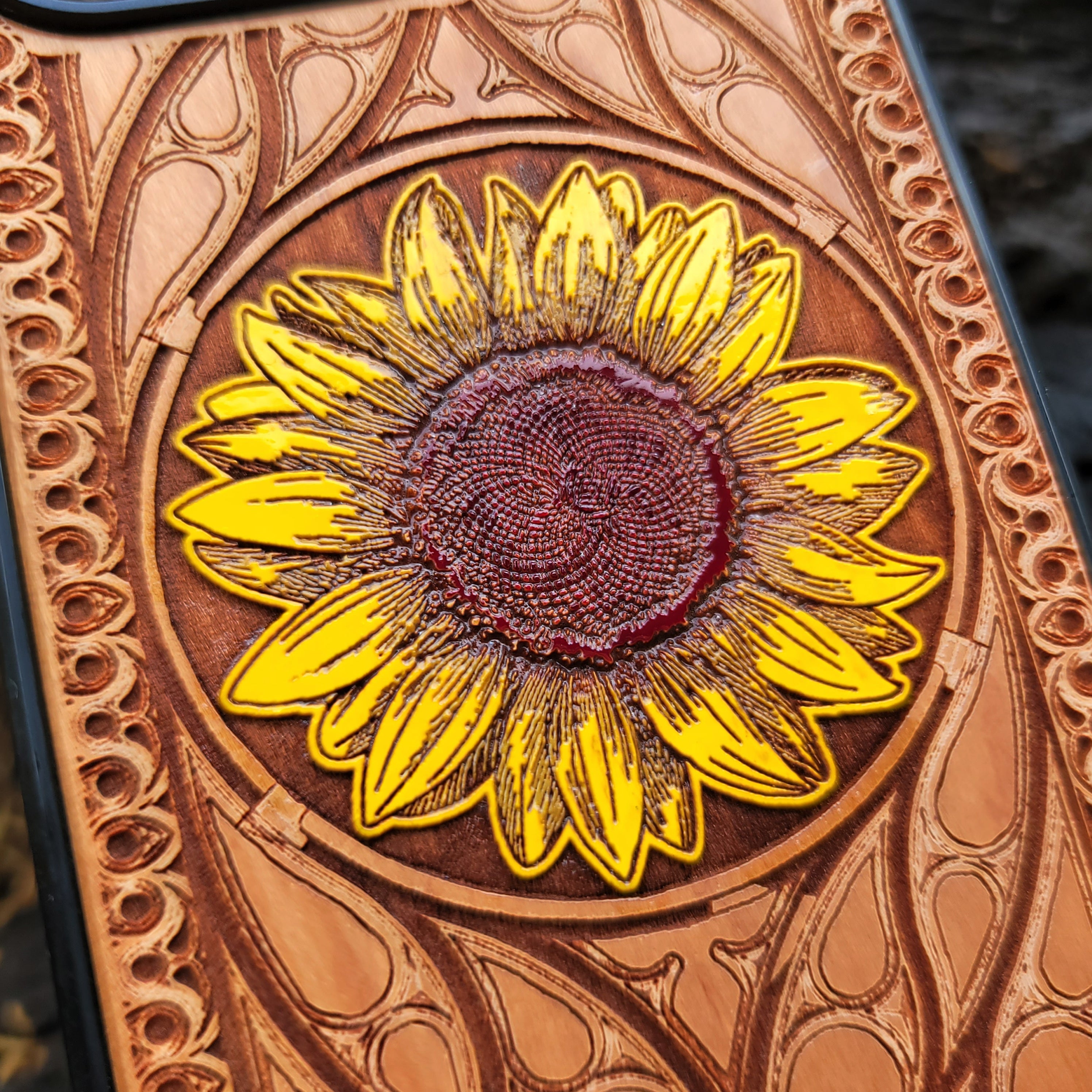 Laser-engraved sunflower design on a wooden phone case, compatible with iPhone and Samsung Galaxy  eco-friendly, slim, and stylish.