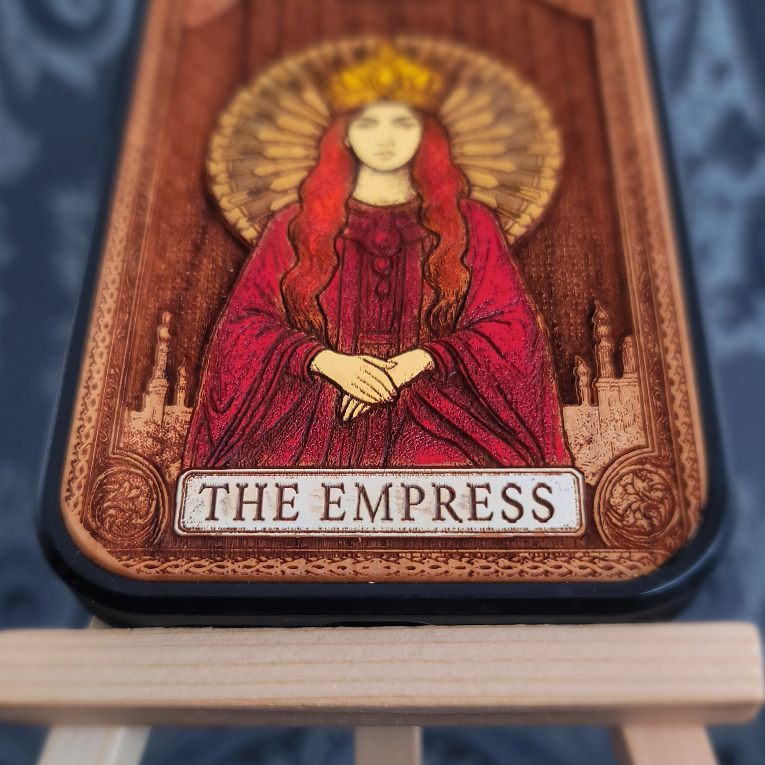 Deep laser engraved wooden phone case featuring The Empress tarot card with mystical celestial details on natural wood for iPhone and Samsung Galaxy models.