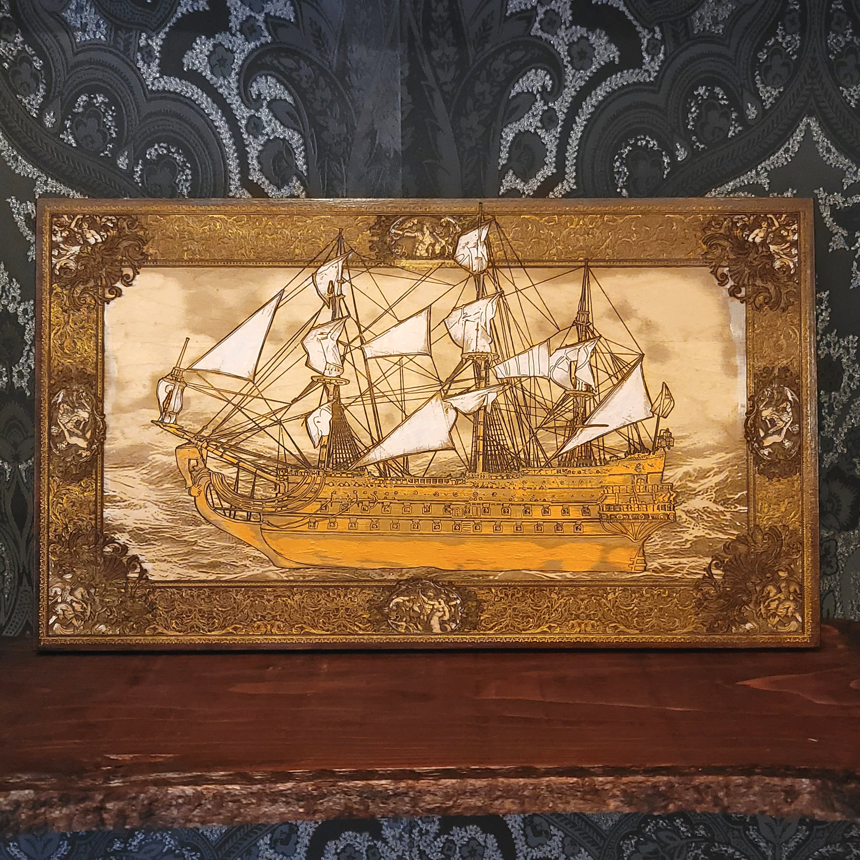 Decorative wall art of a ship with intricate detailing