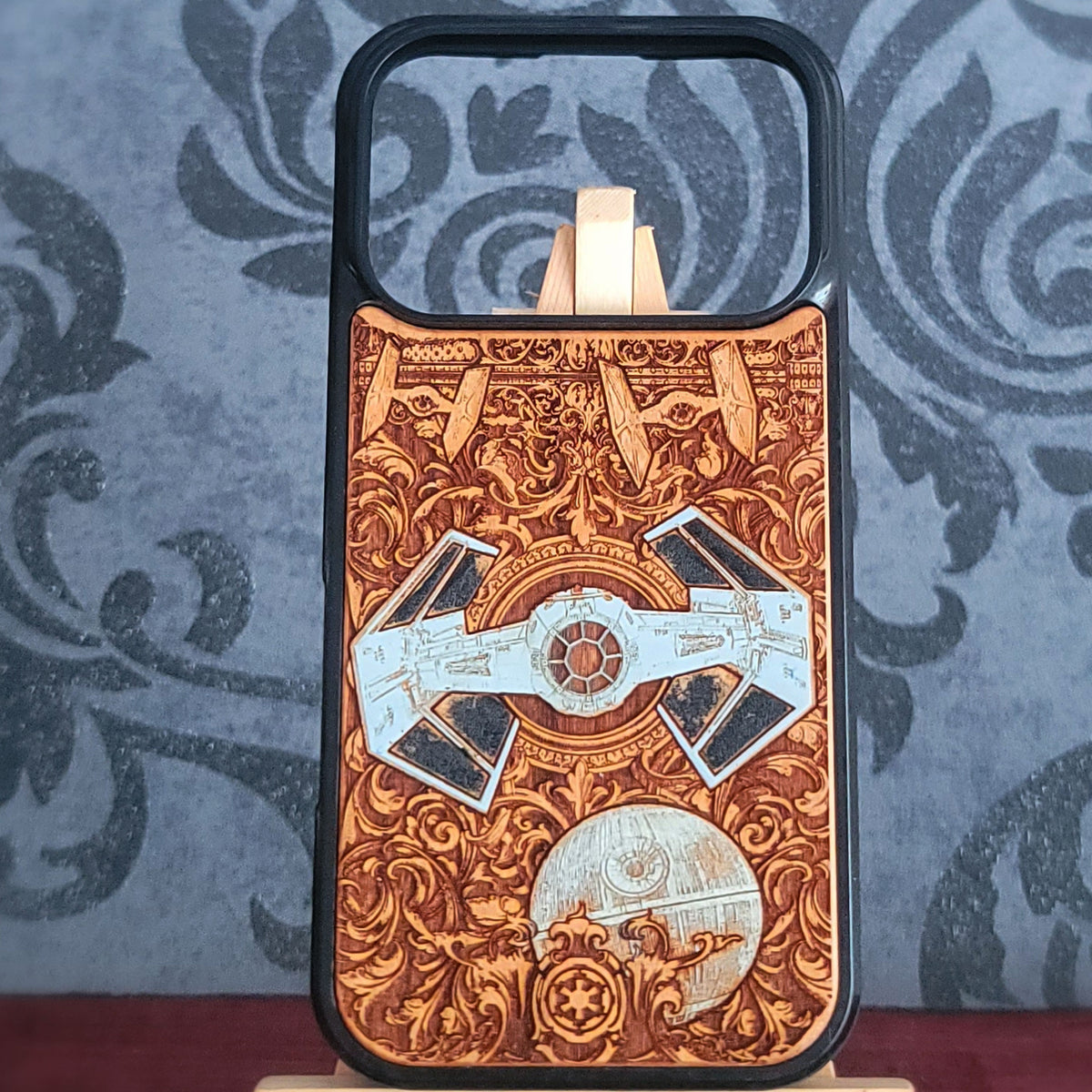 Hand-painted engraved real wood phone case featuring a futuristic space fighter and spherical space station with ornate details