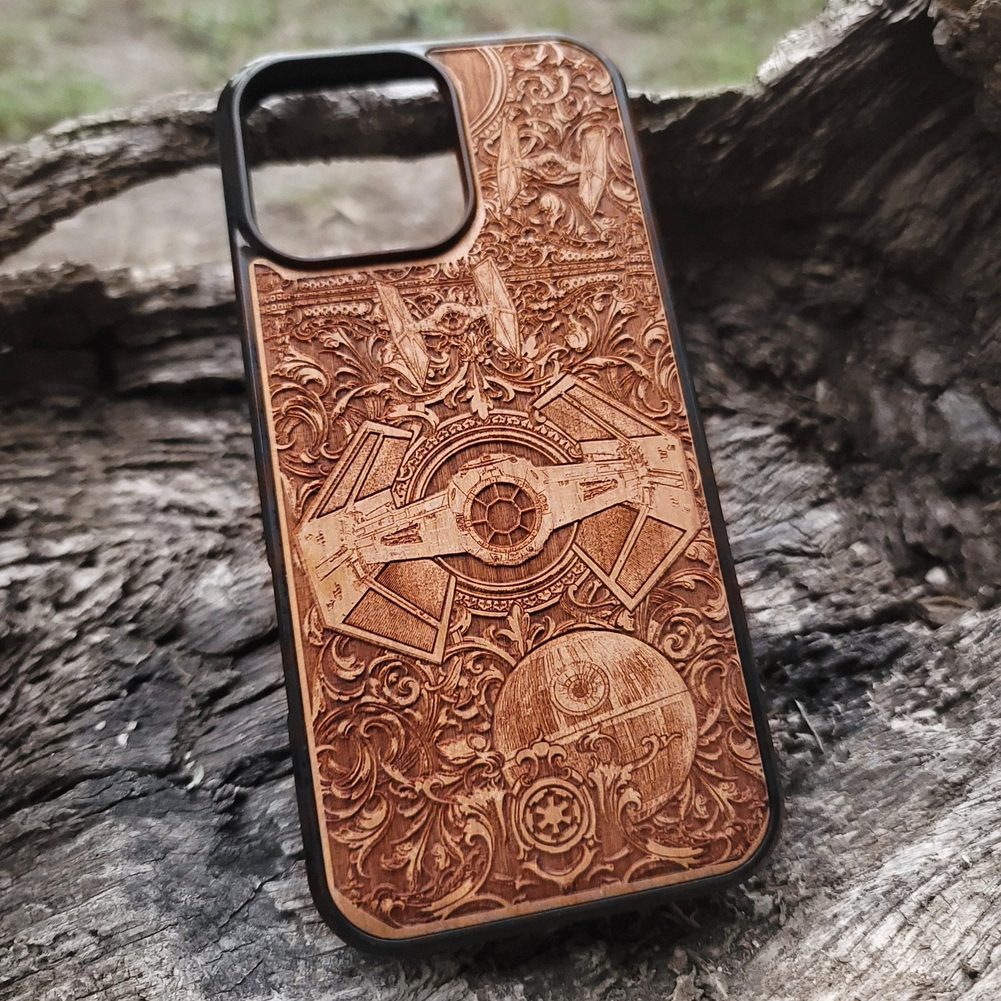 Star Wars wooden phone case with detailed TIE Fighter and Death Star carvings. Designed for iPhone and Samsung Galaxy S, perfect for fans of the Star Wars saga looking for a unique and durable phone accessory.