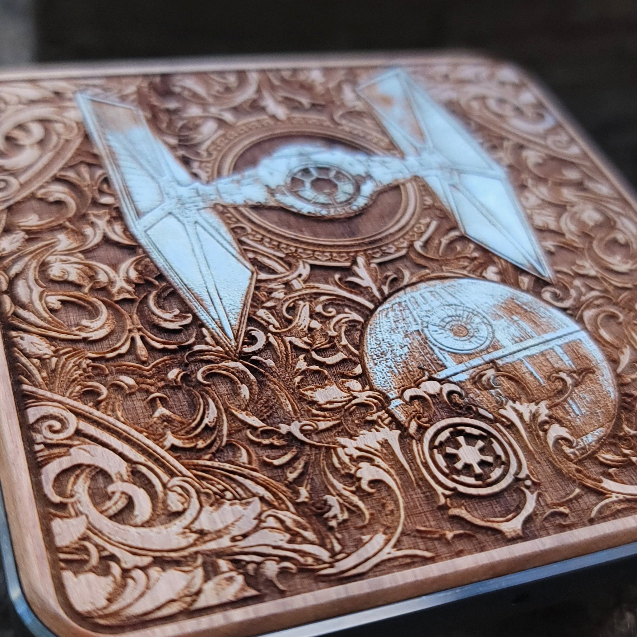 Close-up of sci-fi starship battle painted on wood wireless charger.