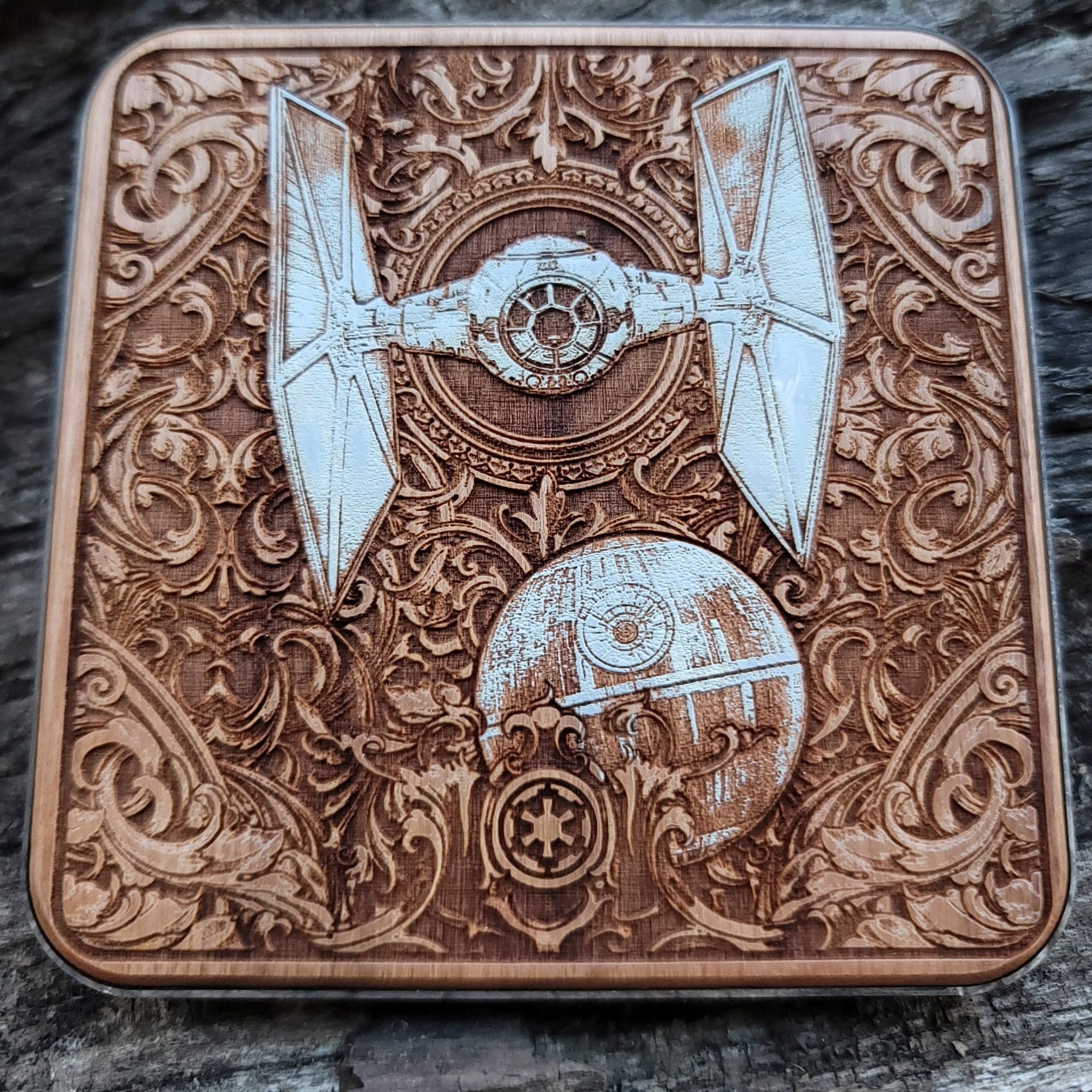 Overhead view of Star Wars-style starships on wooden wireless charger.