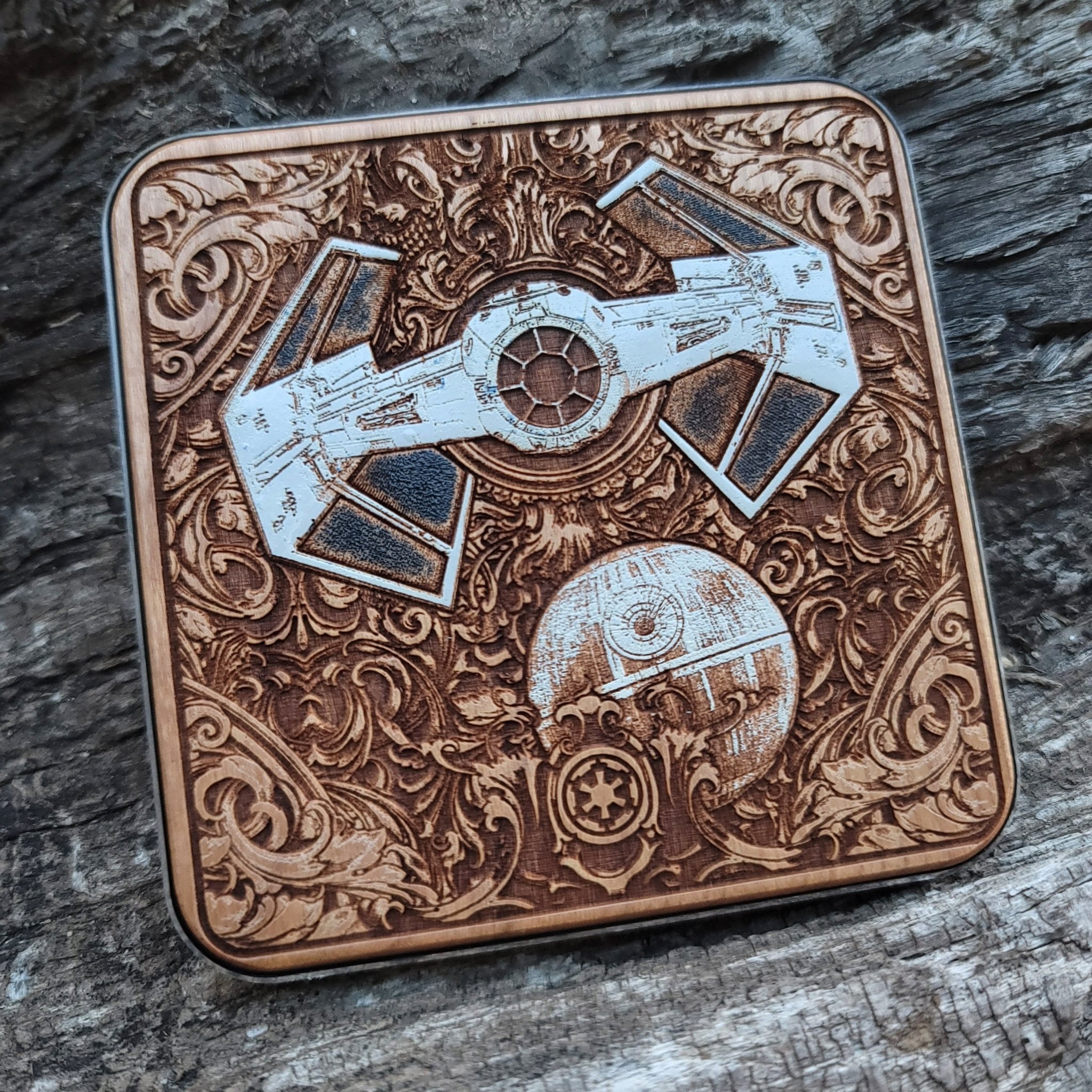 Top view of sci-fi starships painted on dark wood charging pad.