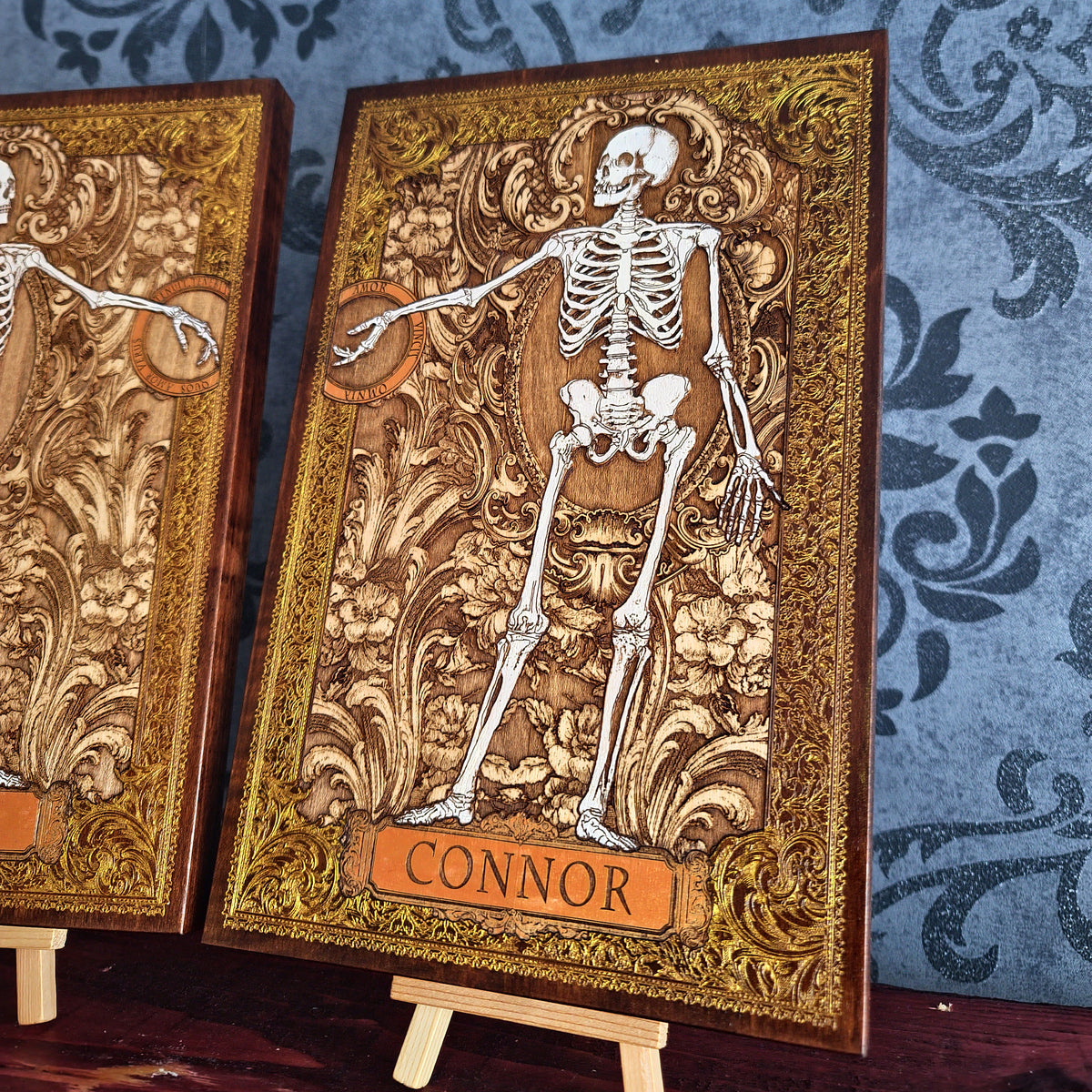 Custom anatomy wall art featuring two human skeletons with personalized name plaques