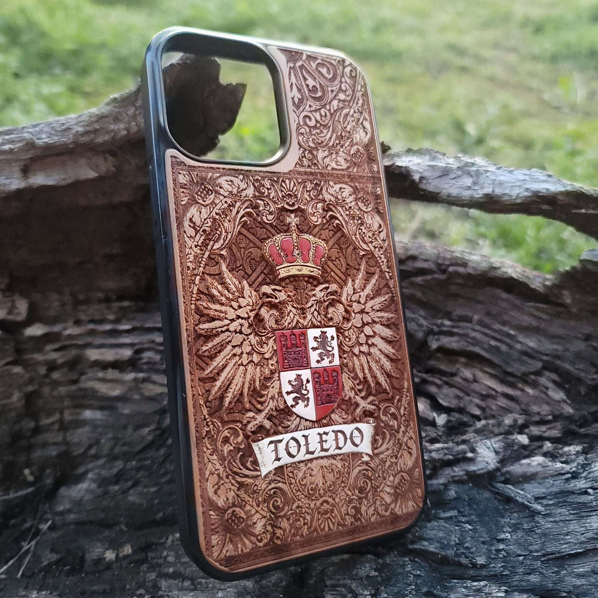 Toledo crest wood phone cover for iPhone and Galaxy, Spanish heritage design.