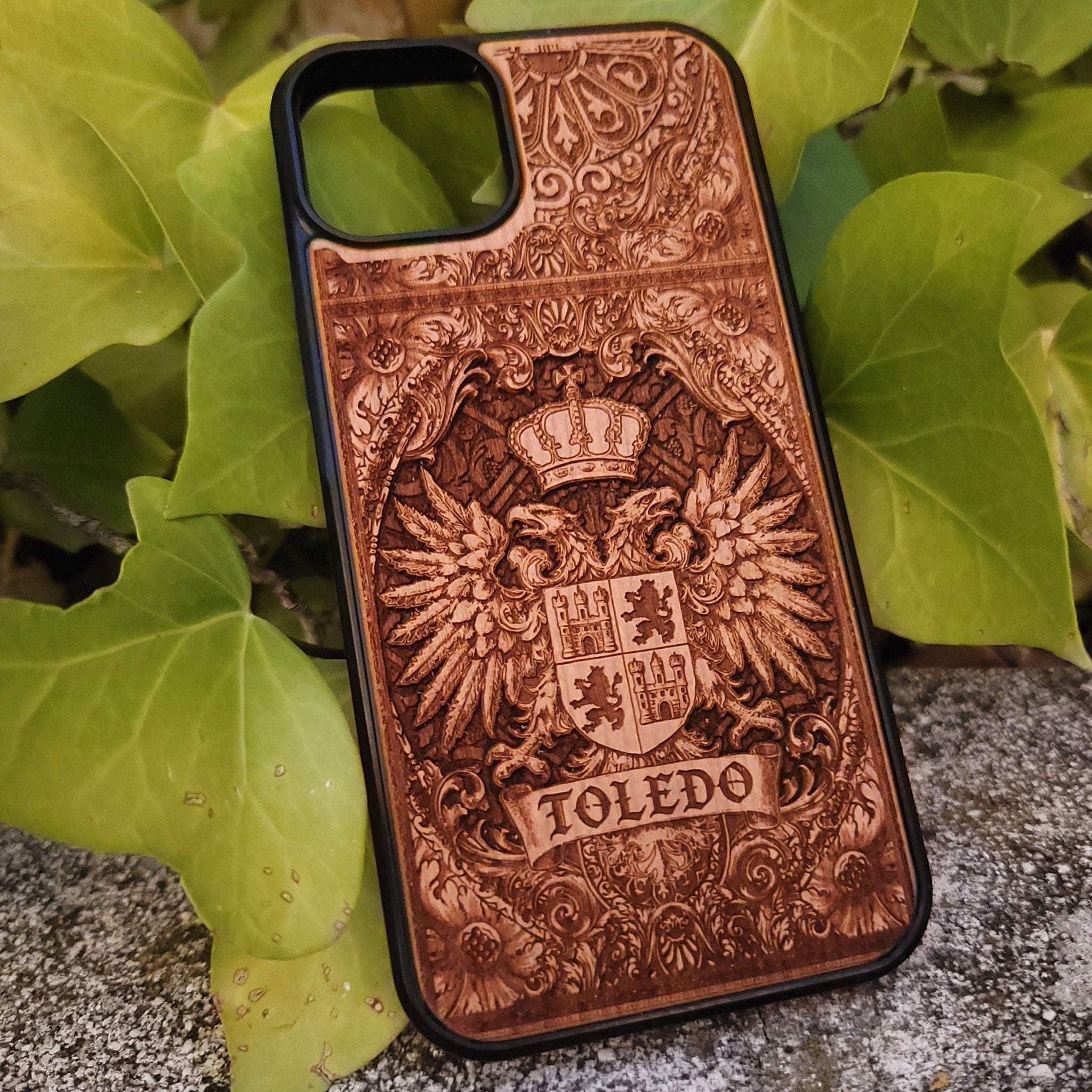 Medieval Toledo crest engraved on a wooden phone case, compatible with iPhone and Samsung Galaxy S.