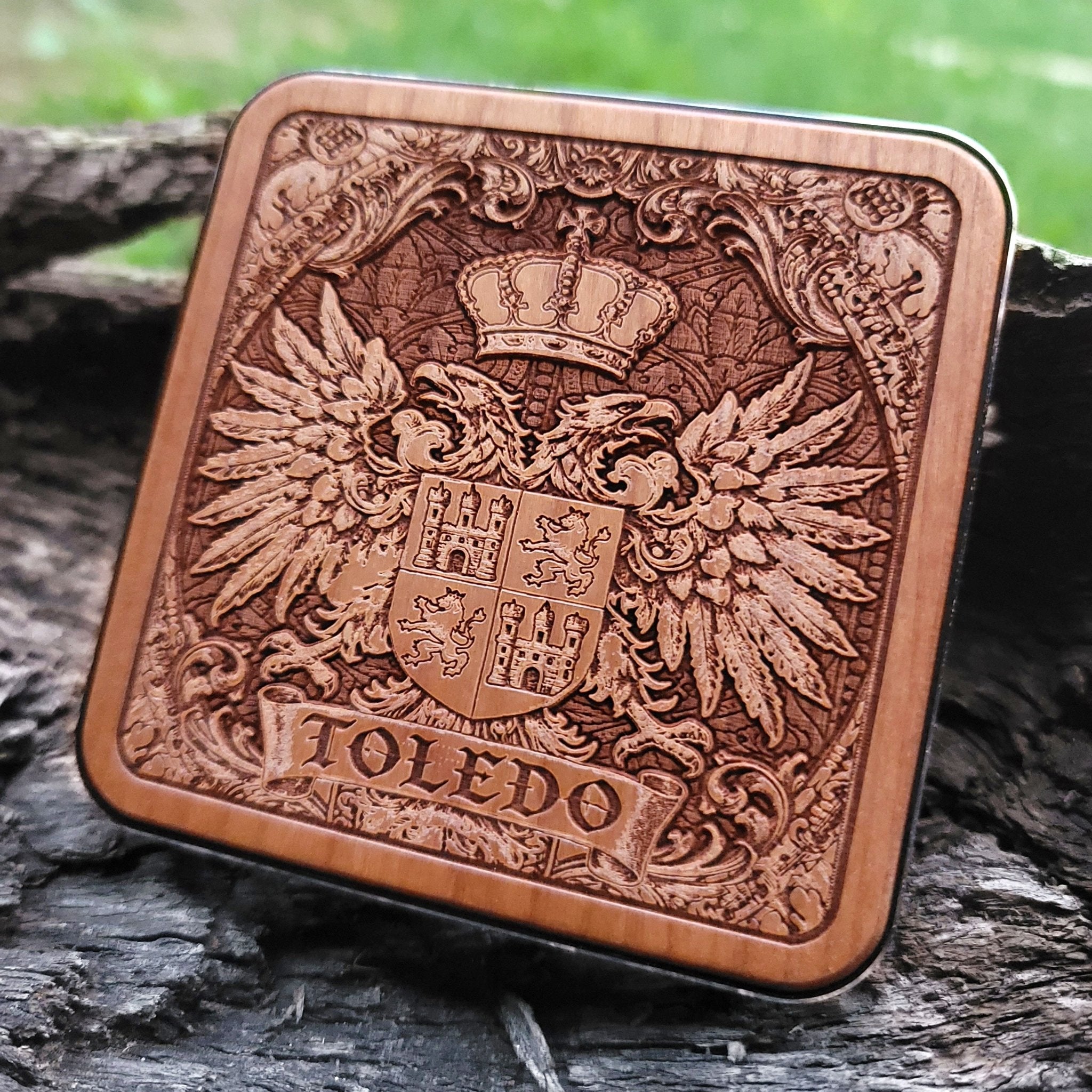 Laser-engraved Toledo coat of arms on wood wireless charger – customizable with your family name or message