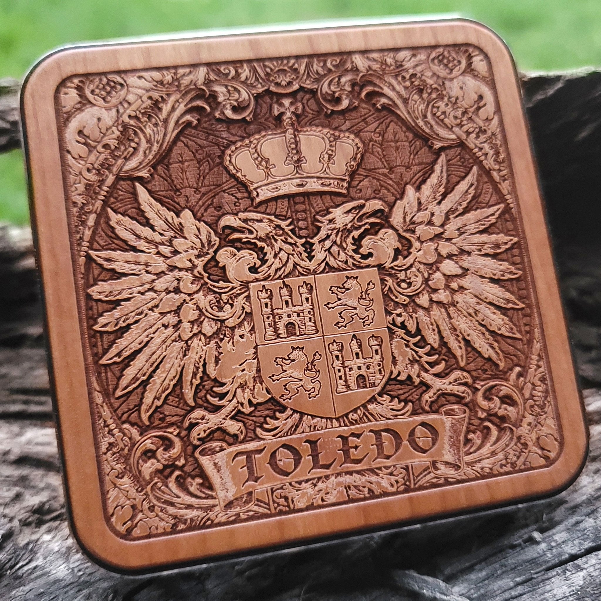 Laser-engraved Toledo coat of arms on wood wireless charger – customizable with your family name or message