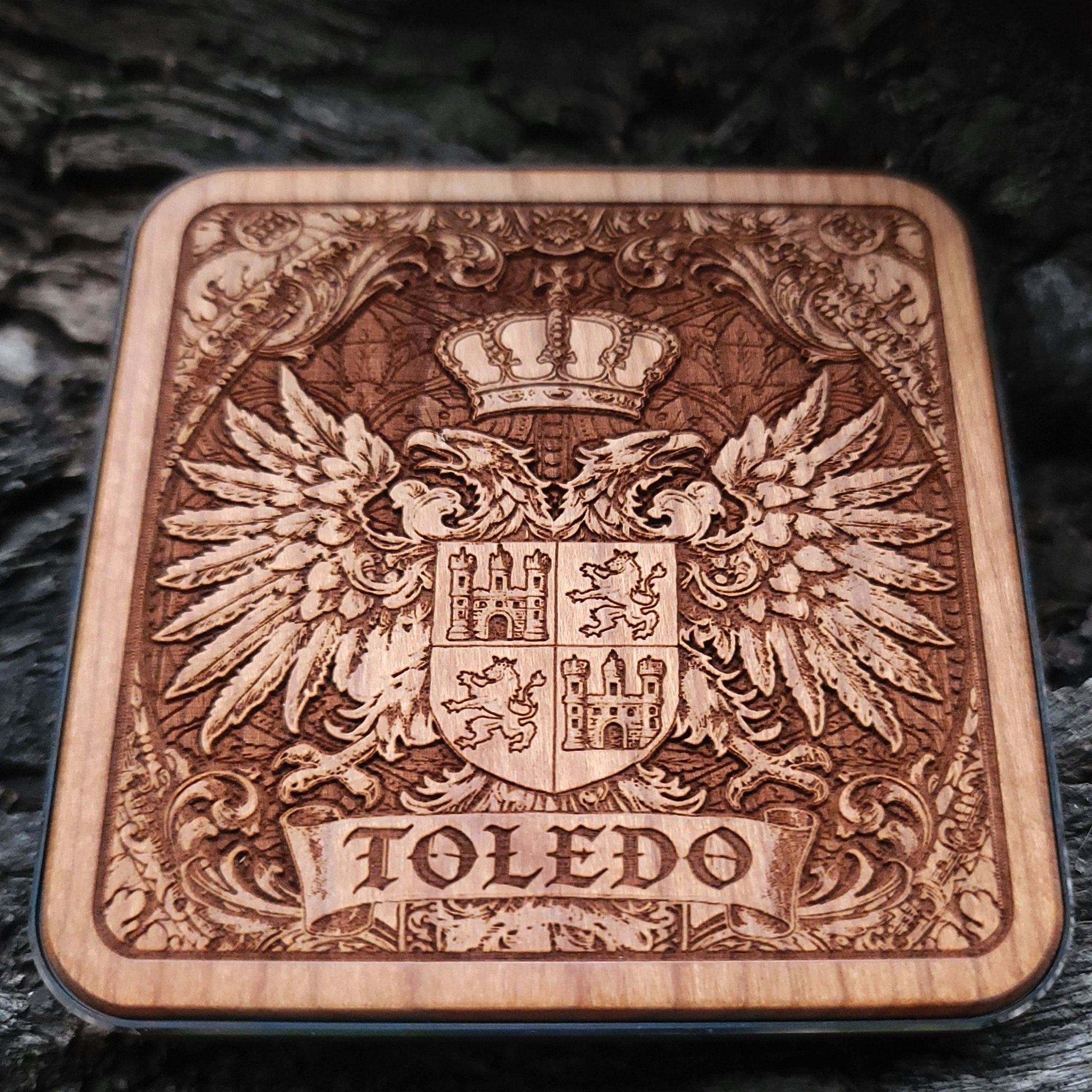 Laser-engraved Toledo coat of arms on wood wireless charger – customizable with your family name or message