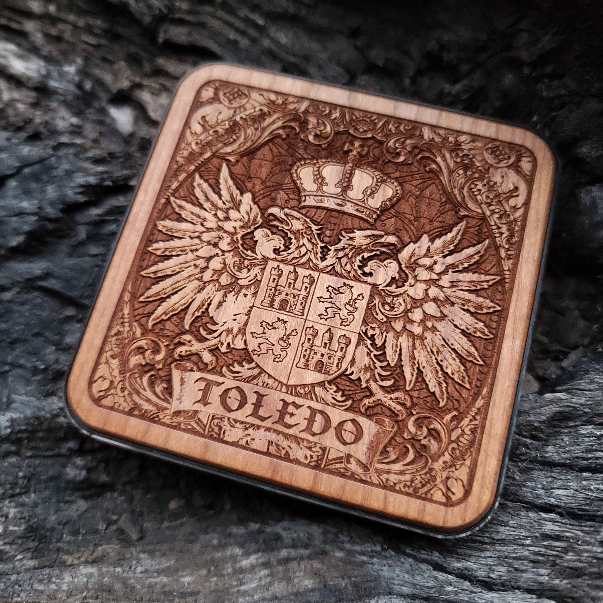 Laser-engraved Toledo coat of arms on wood wireless charger – customizable with your family name or message