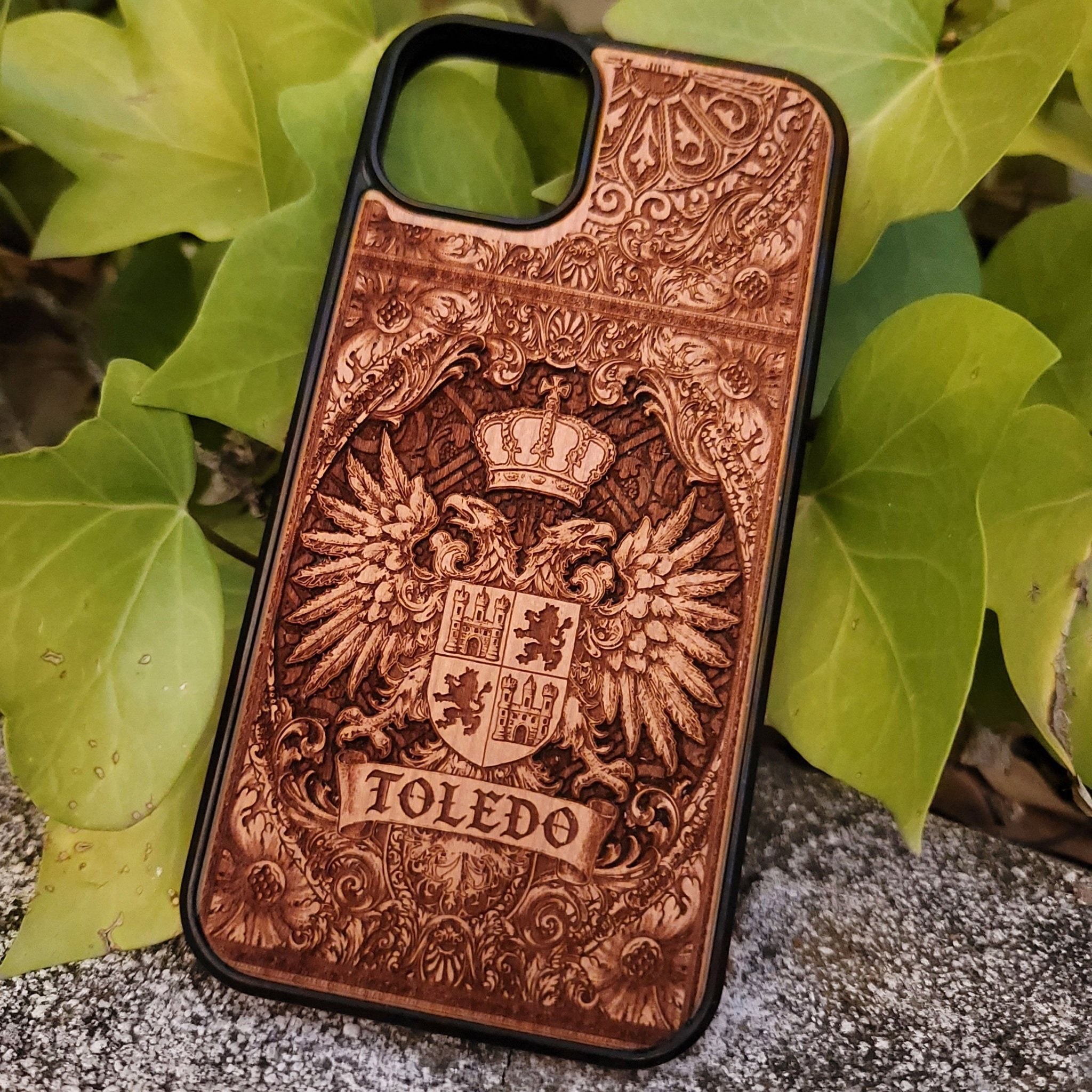 Medieval Toledo crest engraved on a wooden phone case, compatible with iPhone and Samsung Galaxy S.
