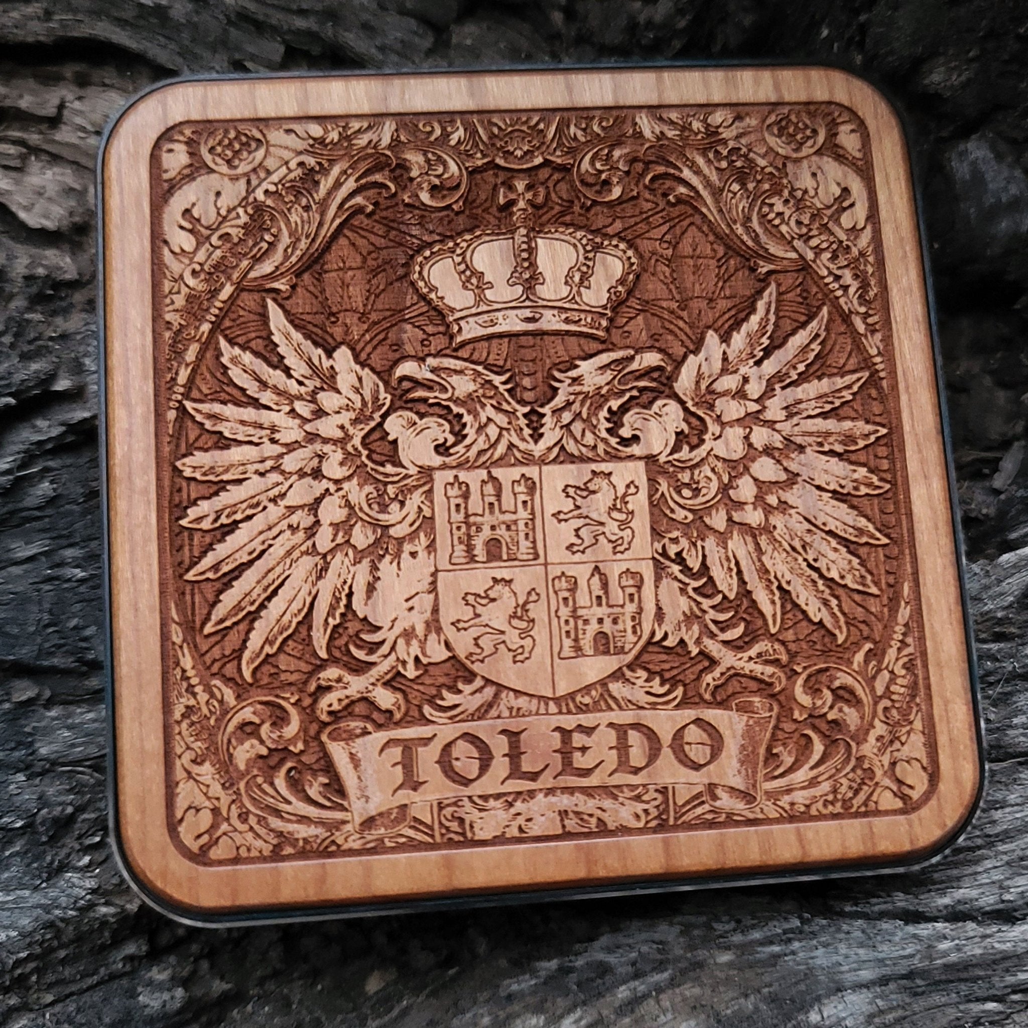 Laser-engraved Toledo coat of arms on wood wireless charger – customizable with your family name or message