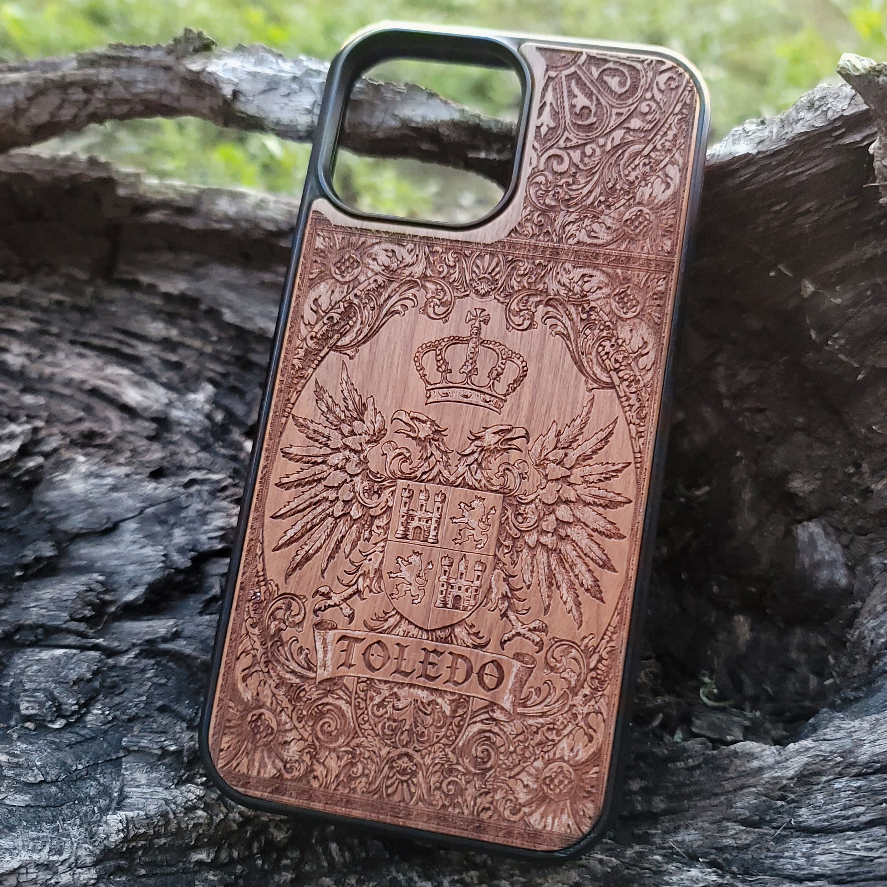 Spanish Toledo family crest laser-engraved on natural wood phone case.
