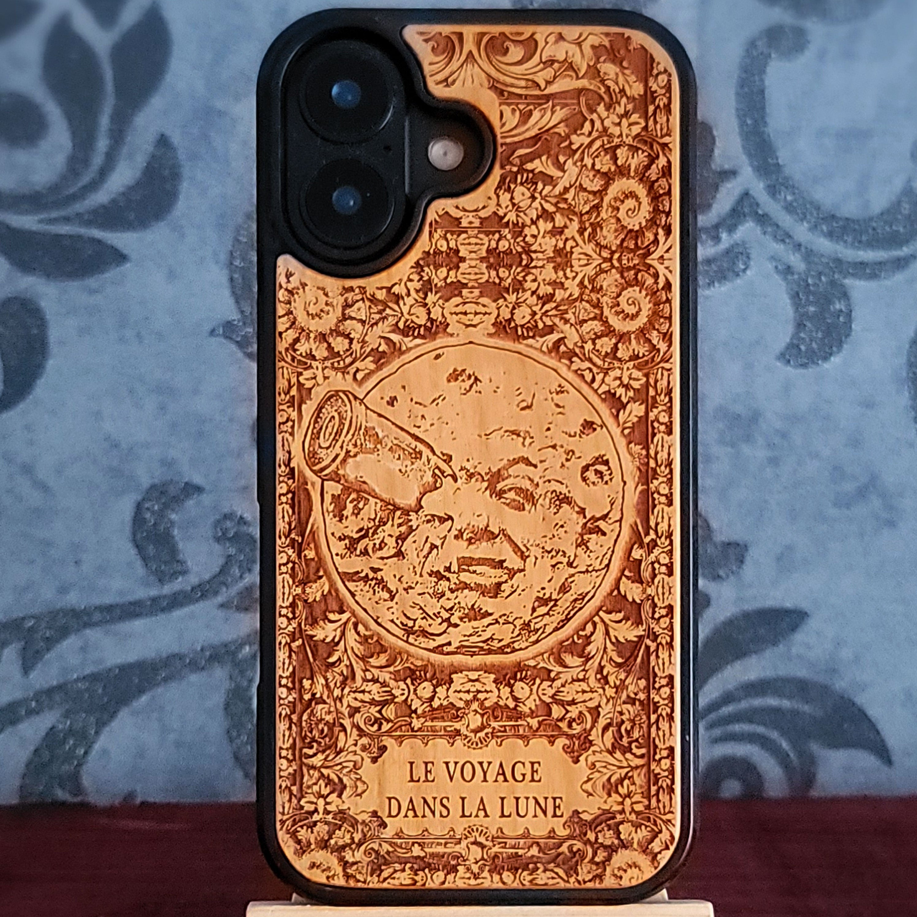 Laser-engraved Voyage Dans La Lune wood phone case for iPhone and Galaxy – vintage sci-fi design.