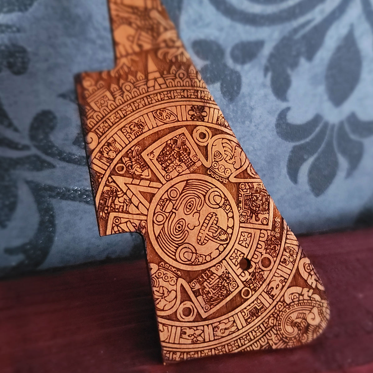 Wooden Les Paul pickguard with detailed Aztec sunstone laser engraving