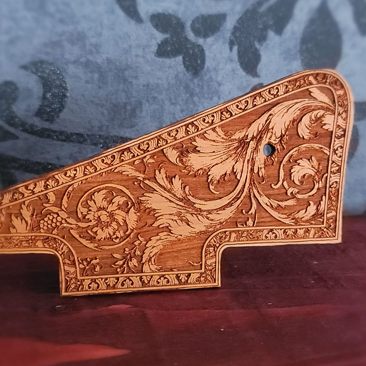 Handcrafted cherry wood pickguard with elegant ornamental engraving for Les Paul style guitar