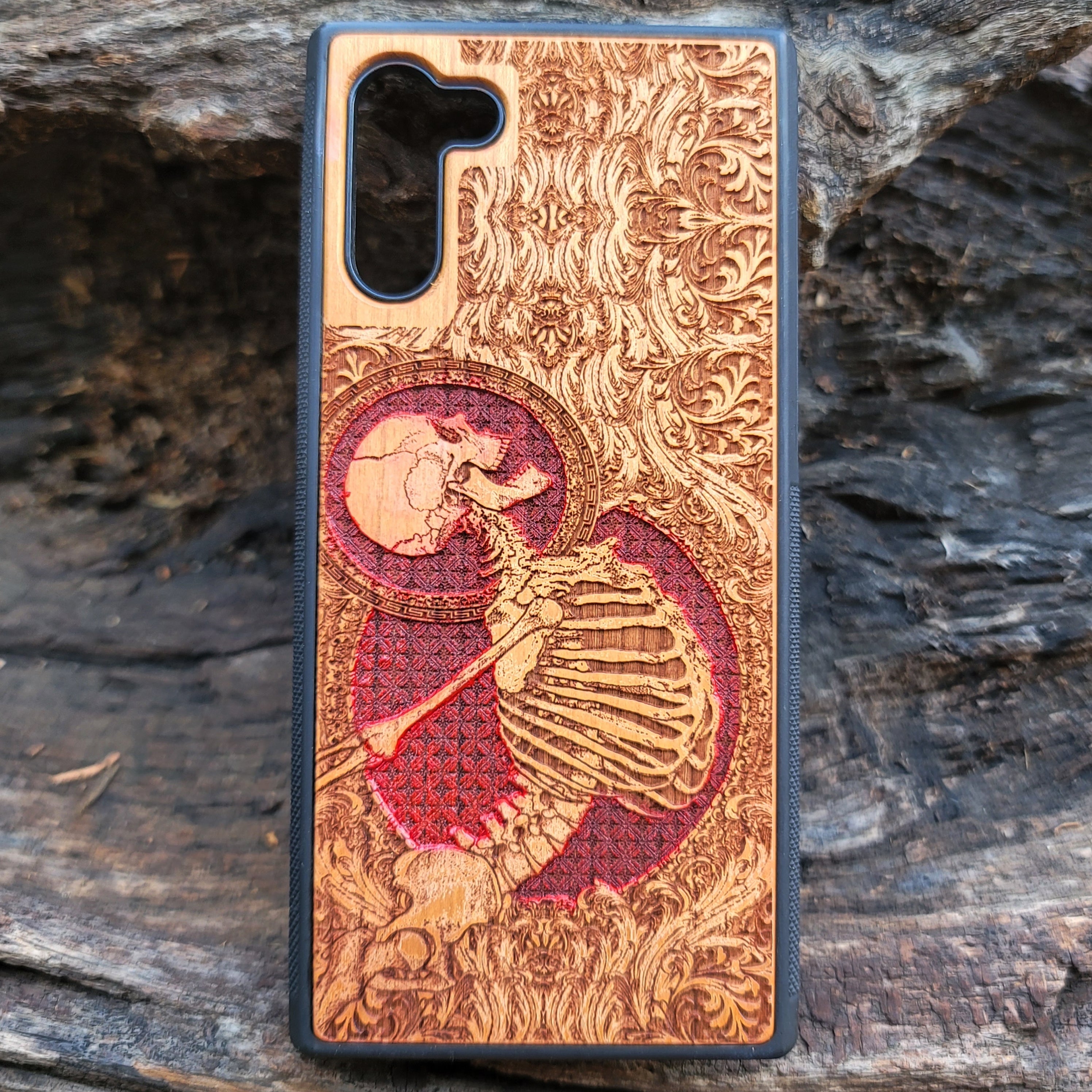 Cherry wood phone case with laser-engraved human skeleton and red Gothic design for iPhone & Samsung Galaxy.