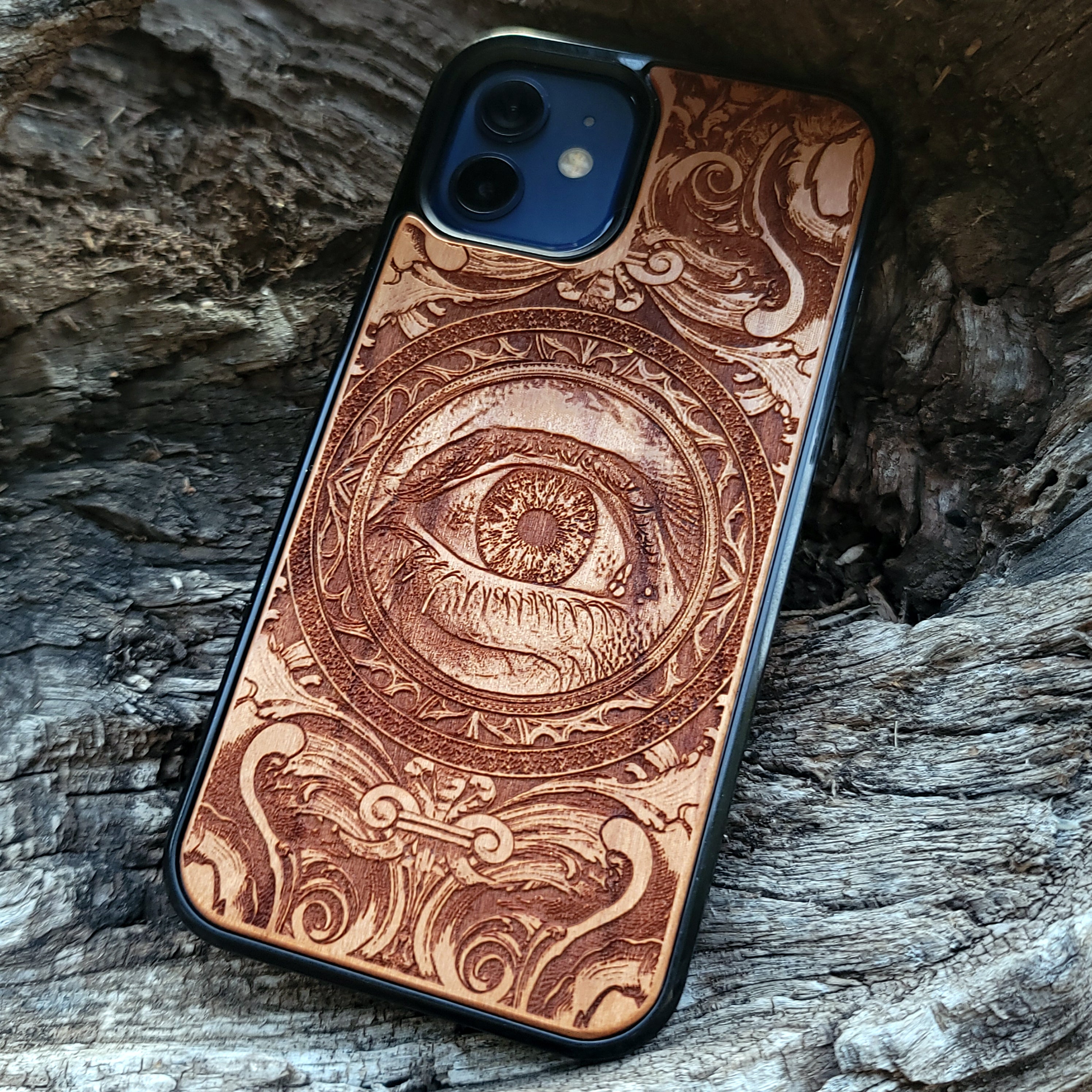 Wooden phone case with an intricate human eye design, featuring detailed gothic art. Compatible with iPhone , iPhone 15, Galaxy S23 Ultra, Note 20, and more. Ideal for lovers of dark fantasy and custom phone accessories.