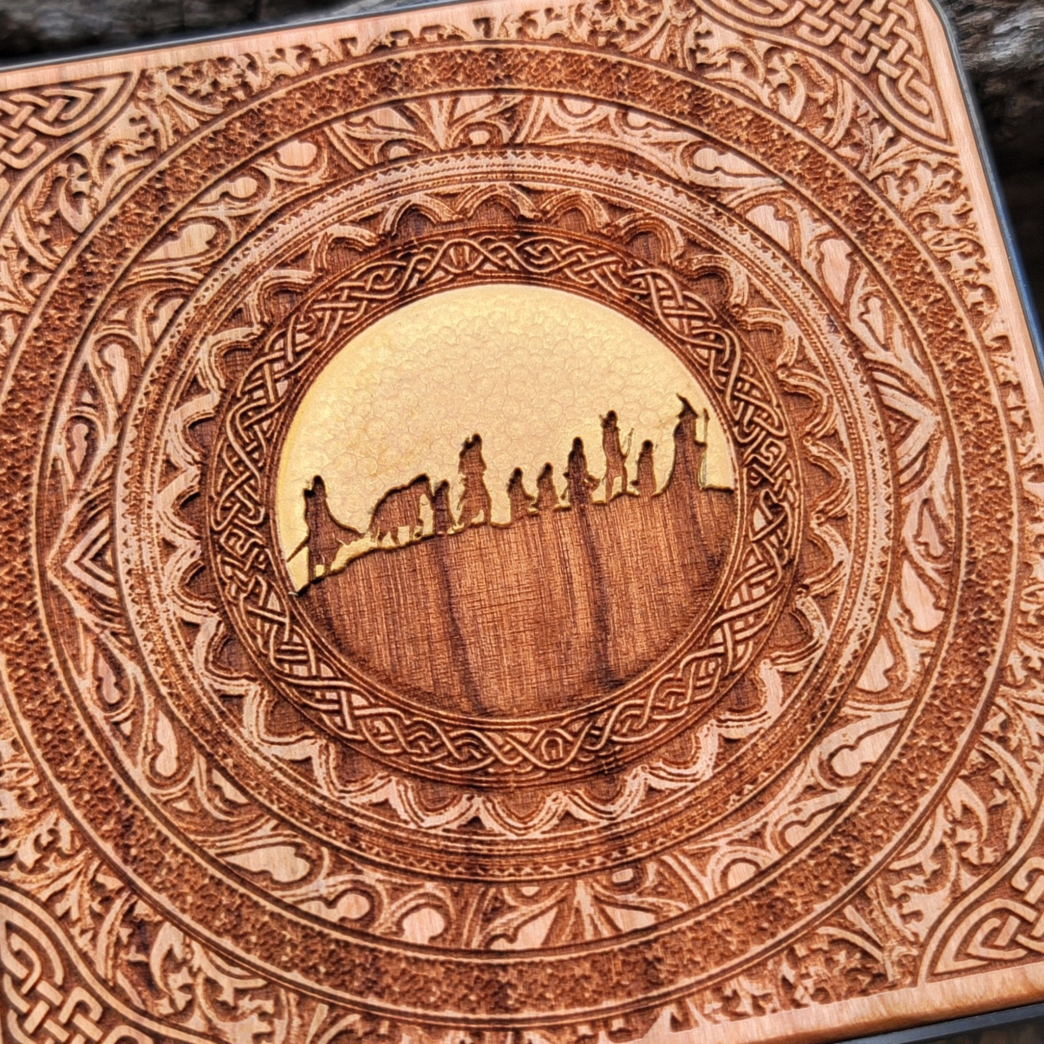 Fantasy desk with Fellowship of the Ring wood wireless charger.