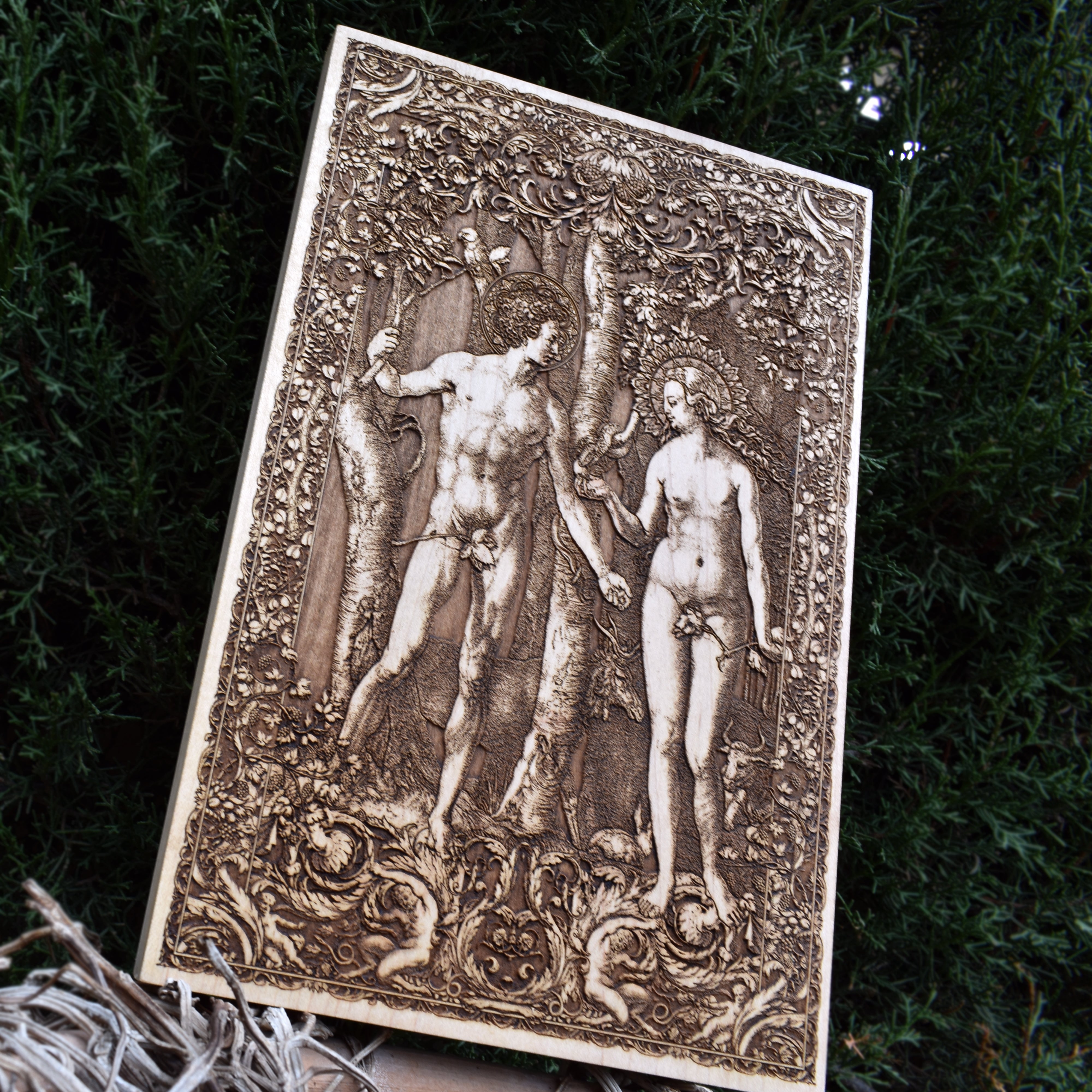 Adam and Eve laser-engraved wood art, perfect for religious gifts and wall decor.