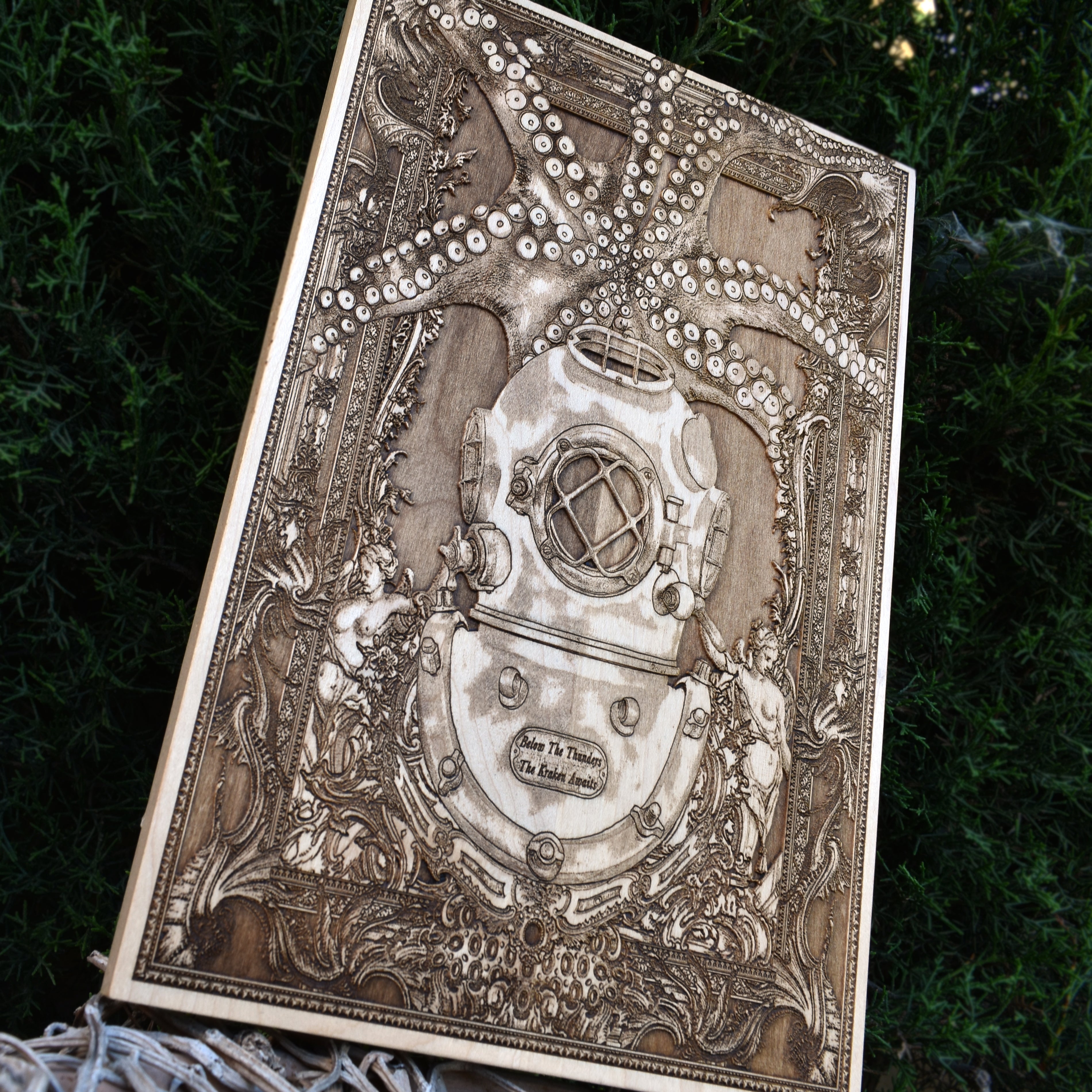 Laser-engraved wooden artwork of an antique diving helmet with a lurking Kraken, inspired by deep-sea mysteries.