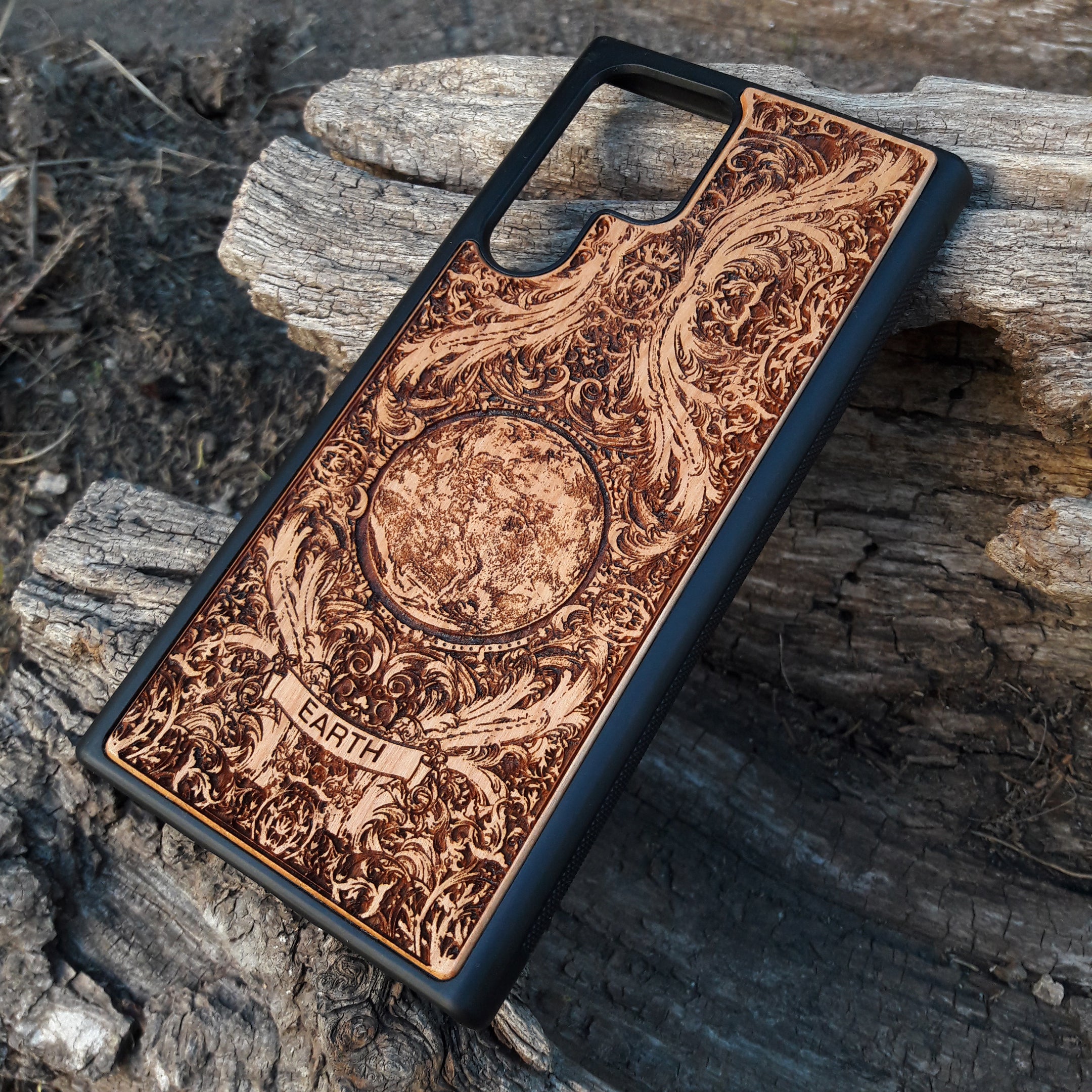 Wooden phone case with a detailed Planet Earth design, available for iPhone , Galaxy S, Note 20, and more. Perfect for eco-conscious users looking for unique, durable phone protection.