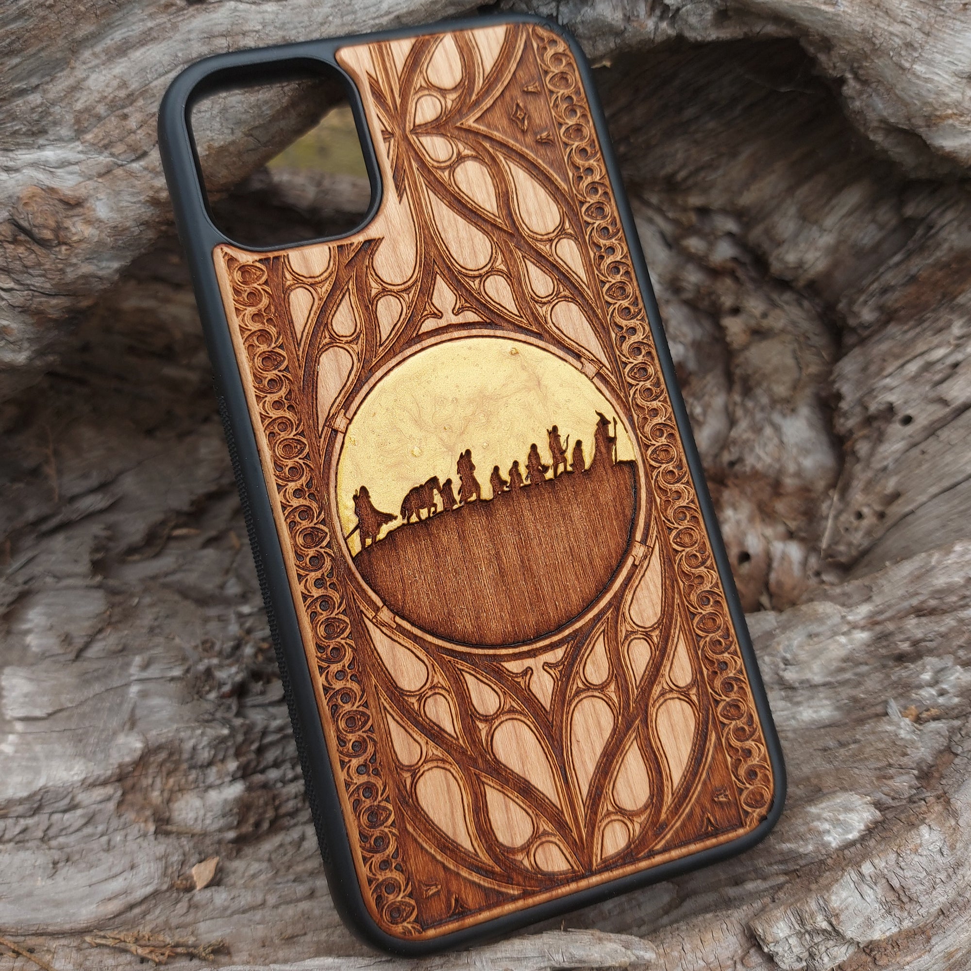 Wooden phone case with Lord of the Rings-inspired custom symbol design. Laser-engraved for iPhone & Samsung Galaxy models, including iPhone , 15, 14, 13, 12, 11 Pro Max, Mini, and Samsung Galaxy S, S24, S23, S22, S21, S20 Ultra, Plus, Note 20. Unique, durable, and perfect for Tolkien fans!