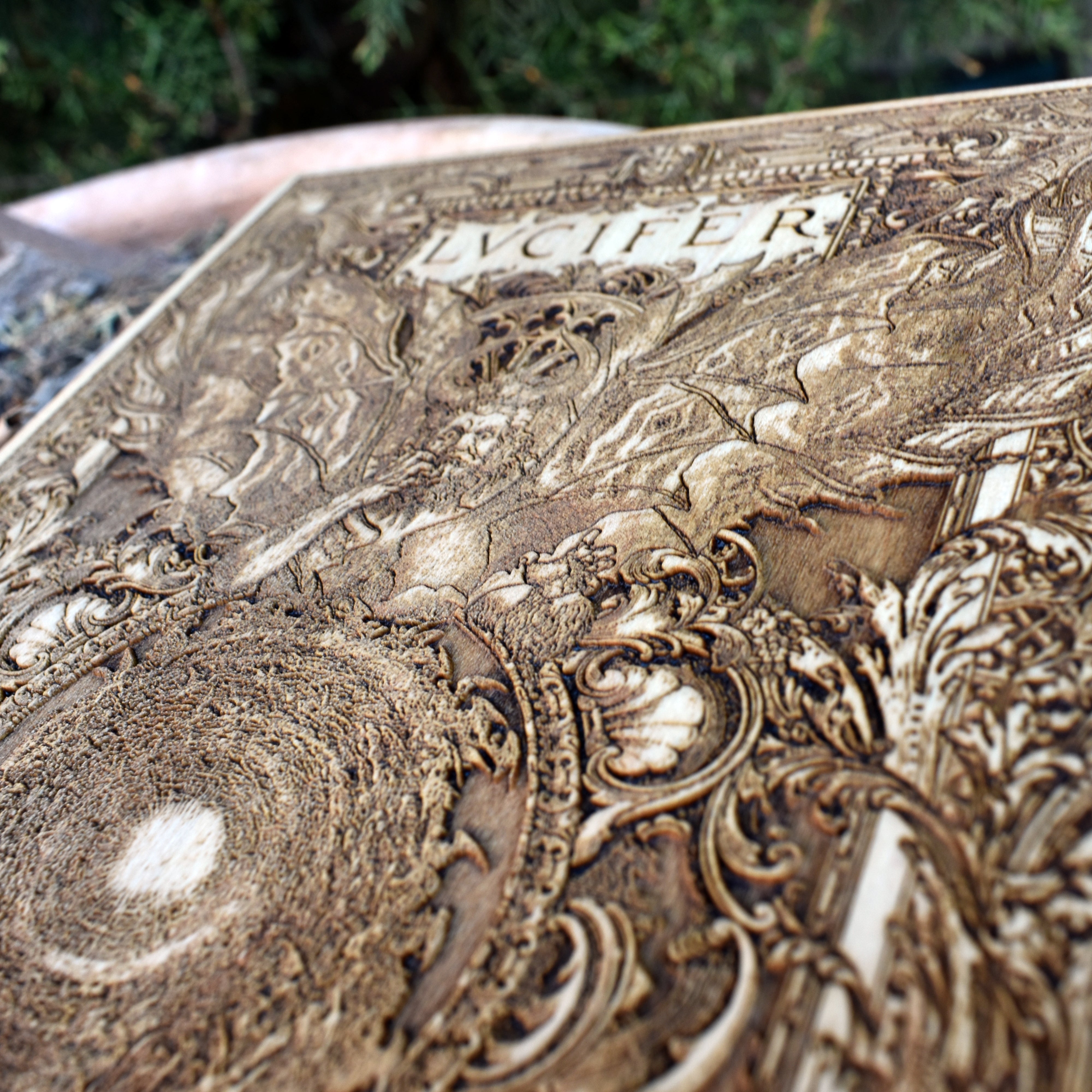 Engraved demon art on wood – vintage Lucifer design for pagan rituals.