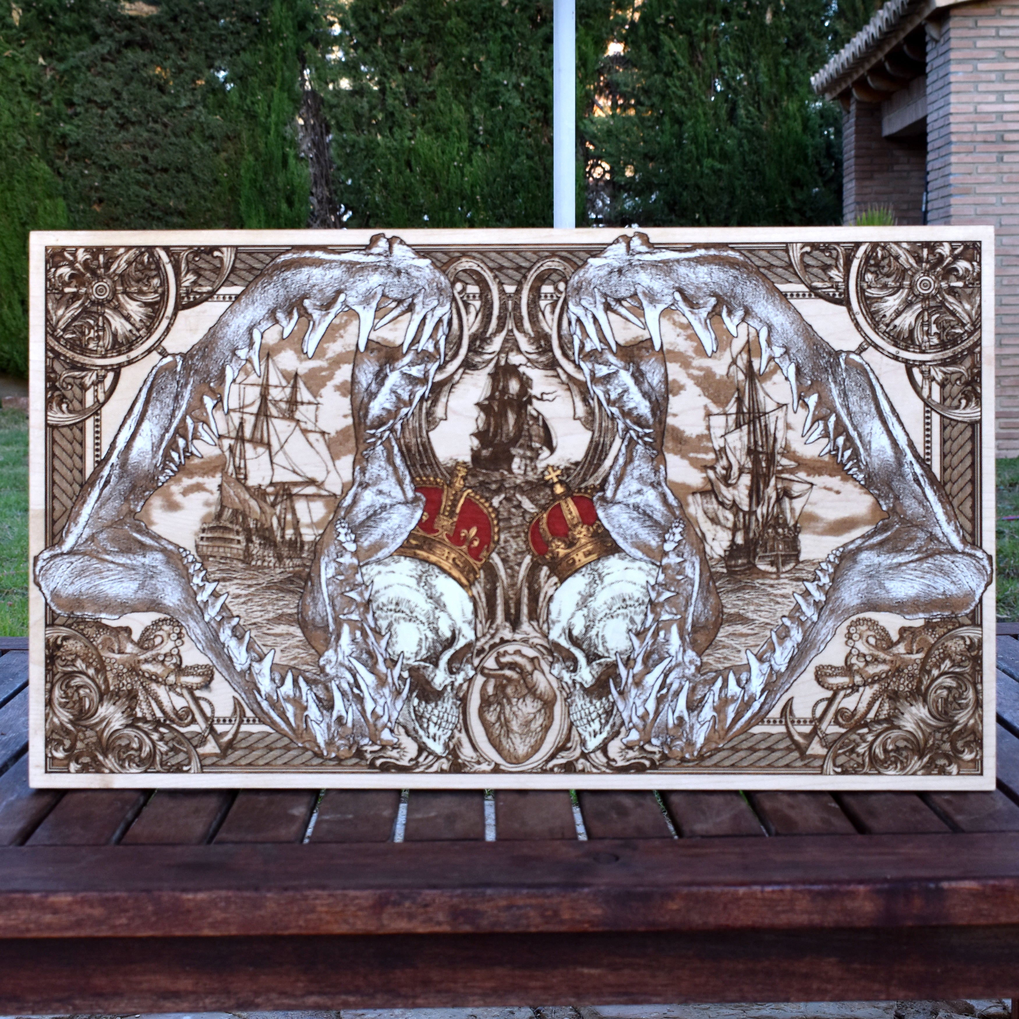 Extra-large shark jaw and pirate ship wood wall art, full front view with giant shark jaws, skulls and red crowns