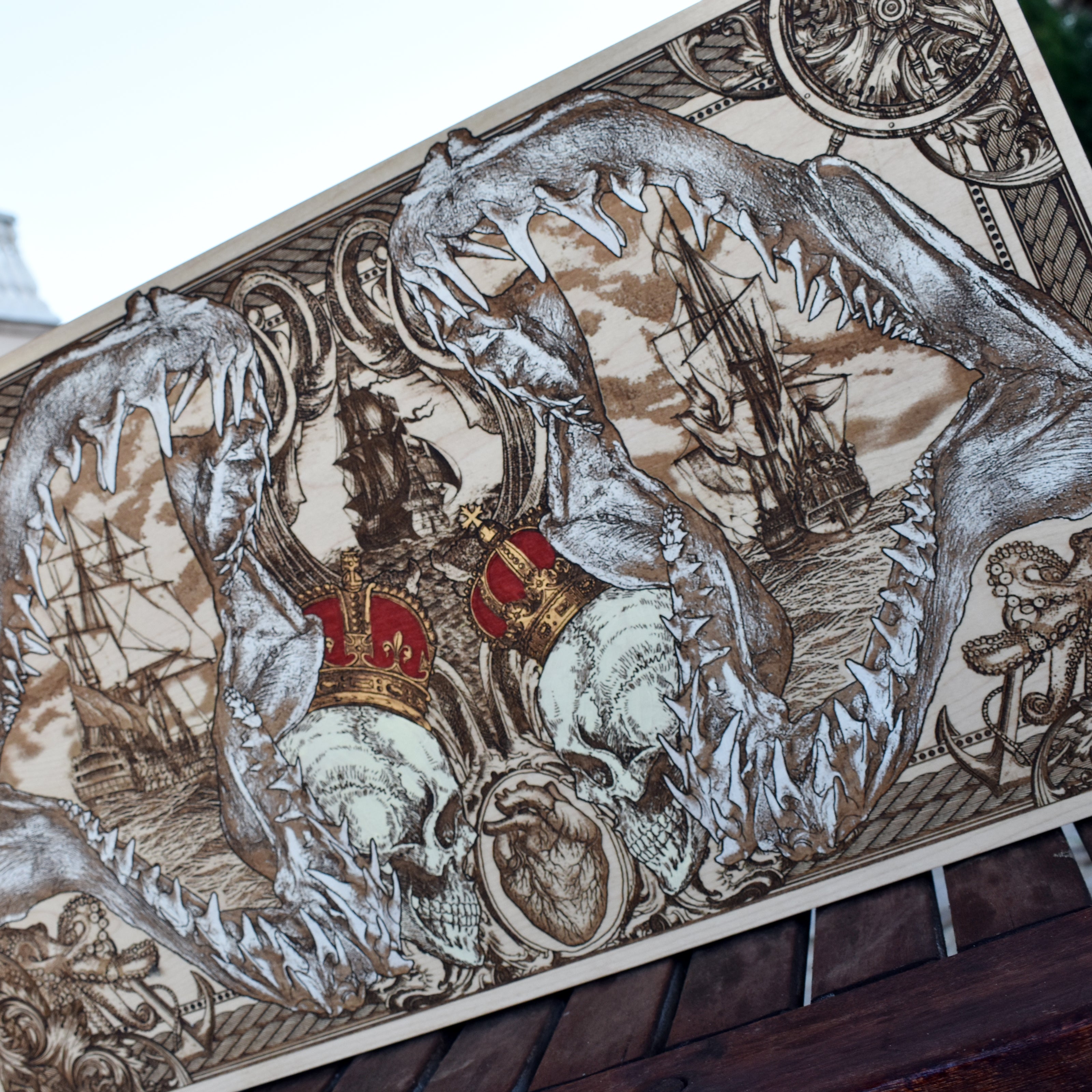 Extra-large shark jaw and pirate ship wood wall art, angled view highlighting the carved shark teeth and ship