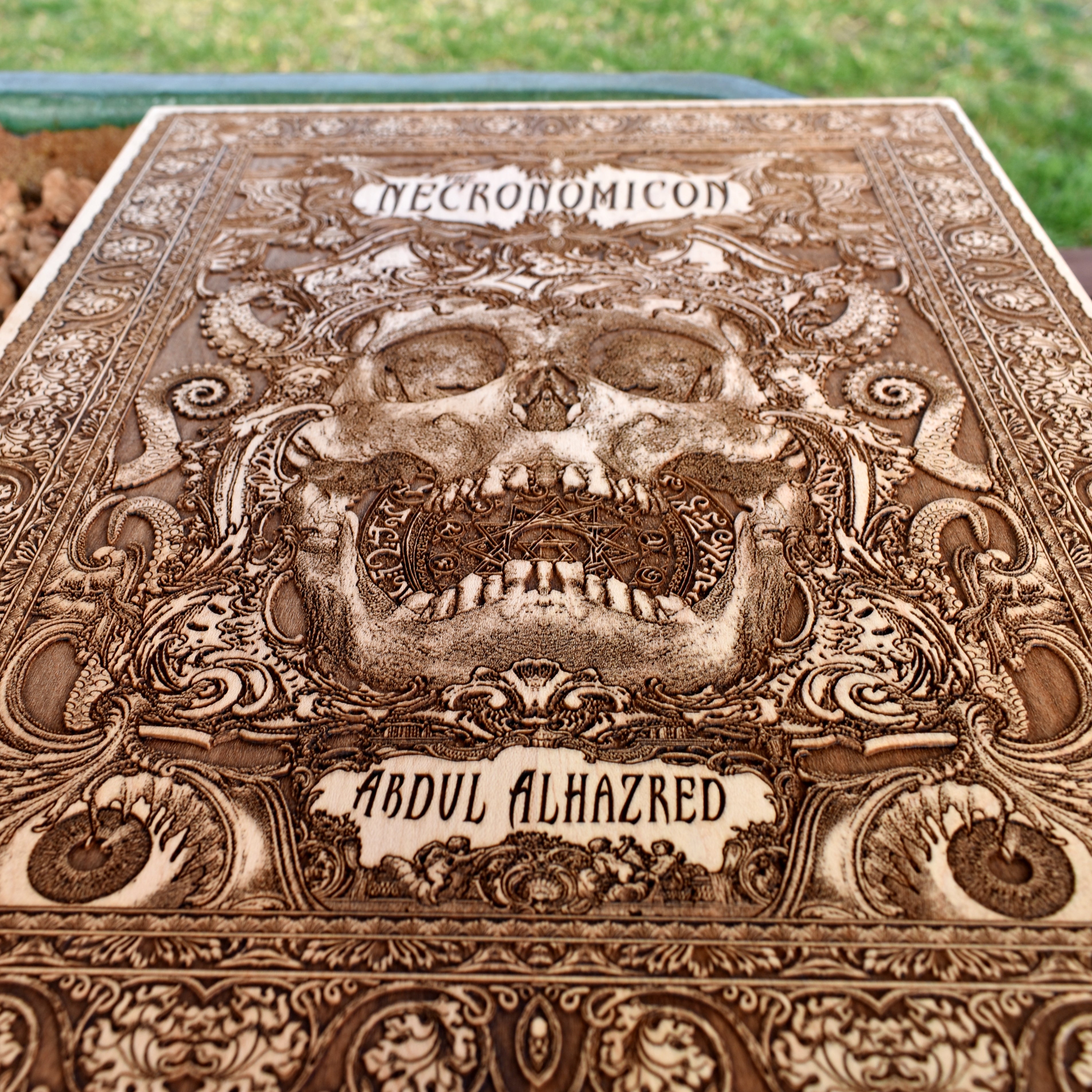 Dark fantasy wall plaque with Cthulhu book symbol
