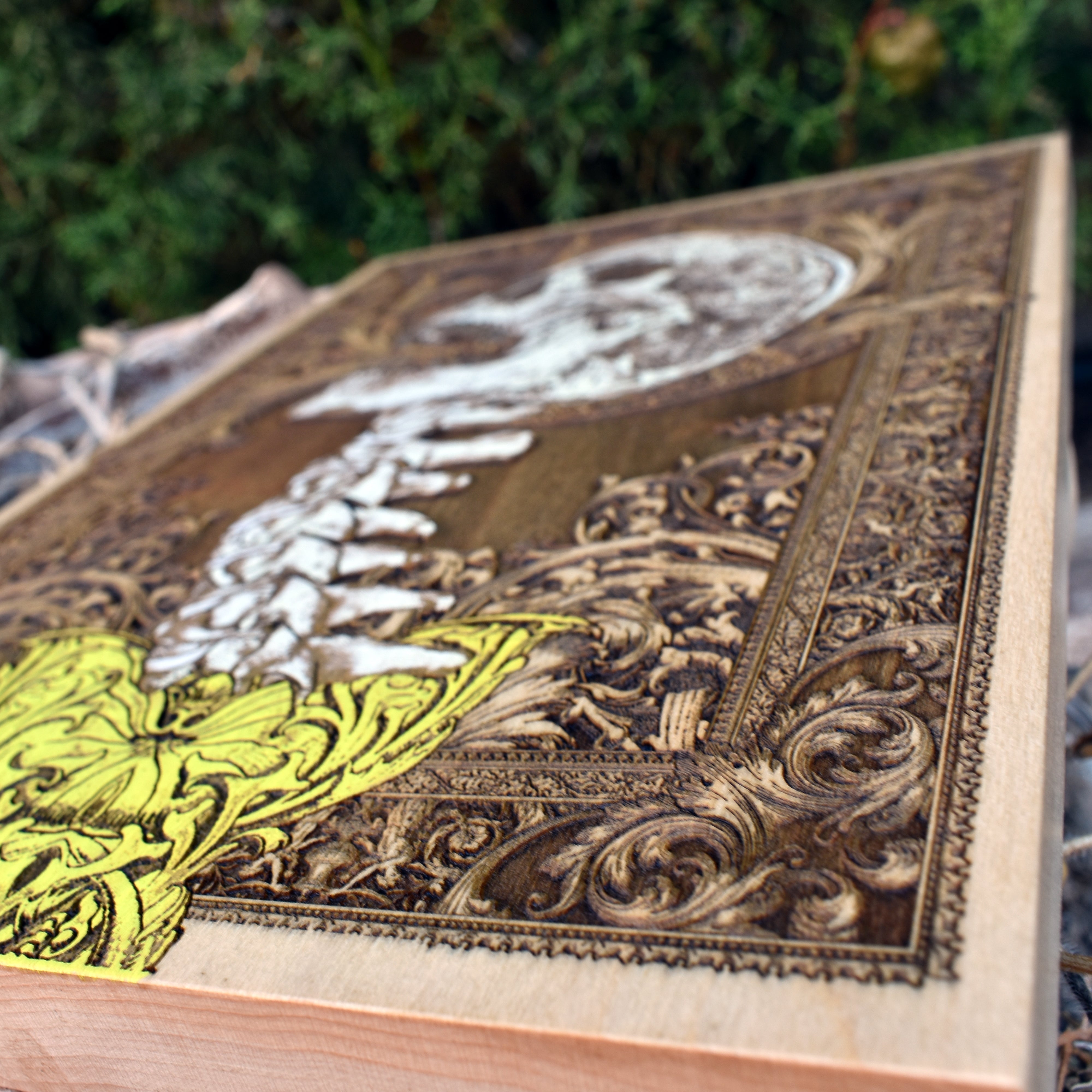 Gothic anatomical skull and spine artwork on natural wood, horror wall accent.